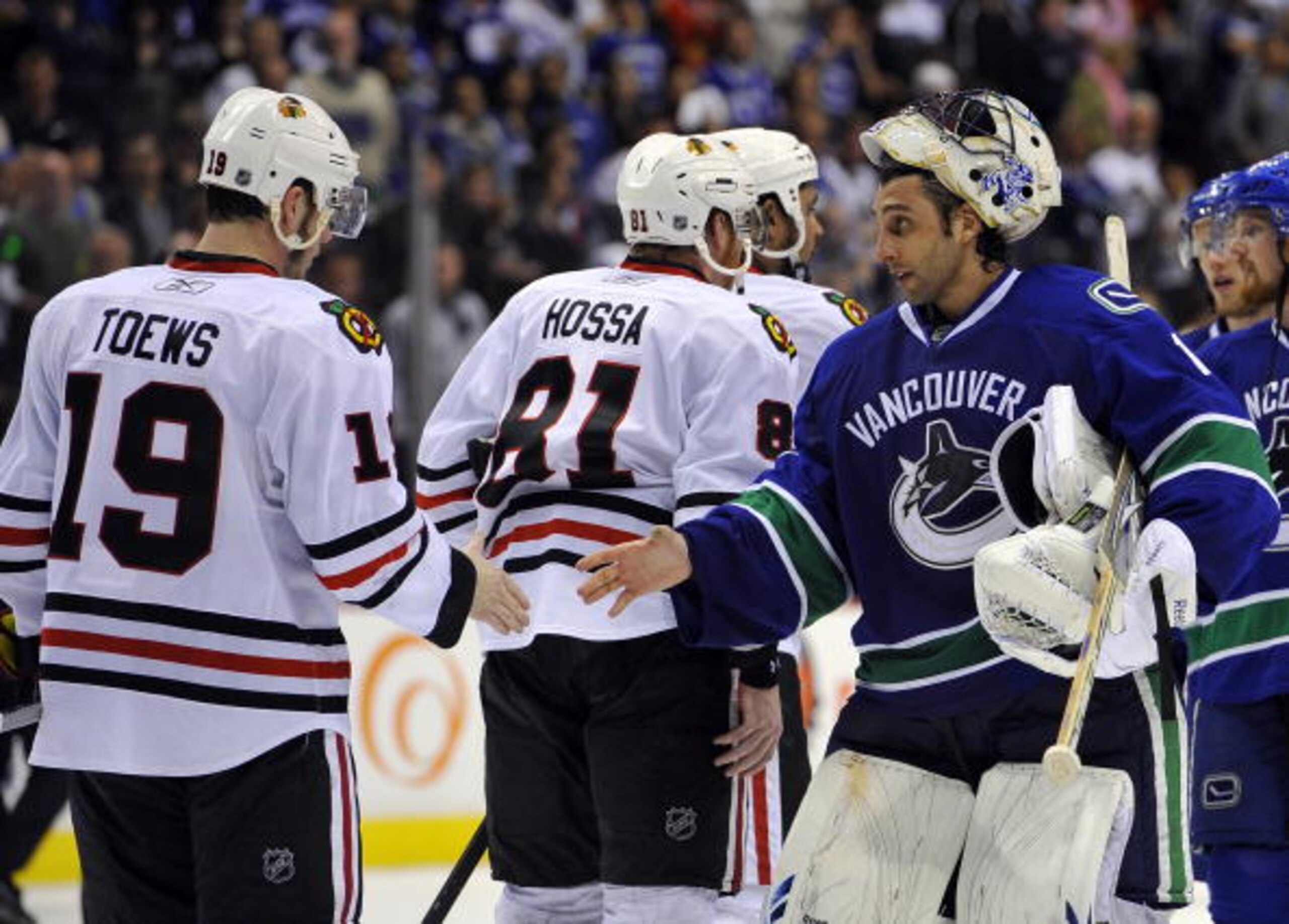 VANCOUVER, CANADA - MAY 11:  Goalie Roberto Luongo #1 of the Vancouver Canucks shakes hands with Jonathan Toews #19 of the Chicago Blackhawks after the Blackhawks defeated the Canucks 5-1 to win Game Six of the Western Conference Semifinals to win the ser