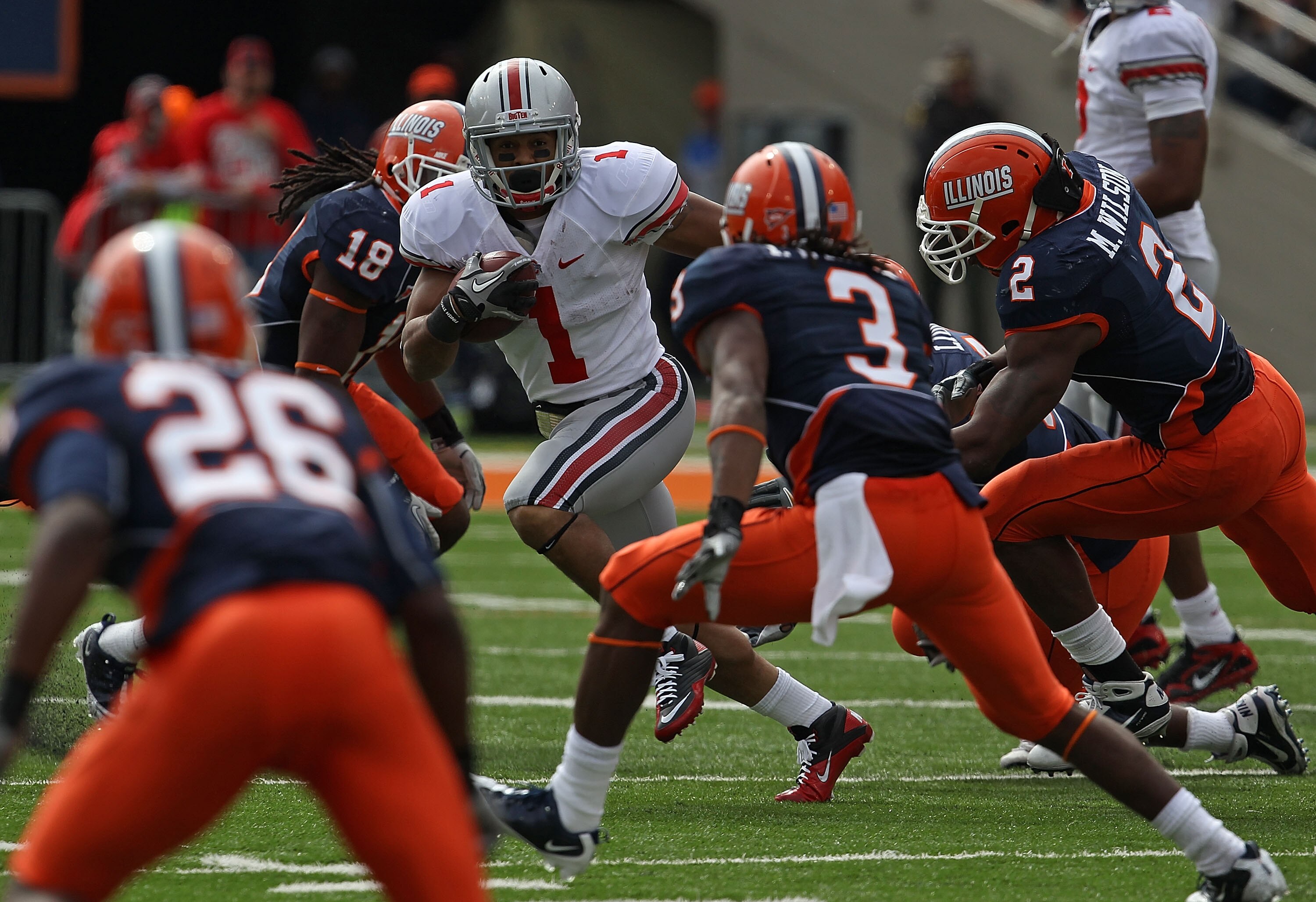 CHAMPAIGN, IL - OCTOBER 02: Dan Herron #1 of the Ohio State Buckeyes runs against members of the Illinois Fighting Illini defense including (L-R) Justin Green #26, Nate Bussey #18, Tavon Wilson #3 and Martez Wilson #3 at Memorial Stadium on October 2, 201