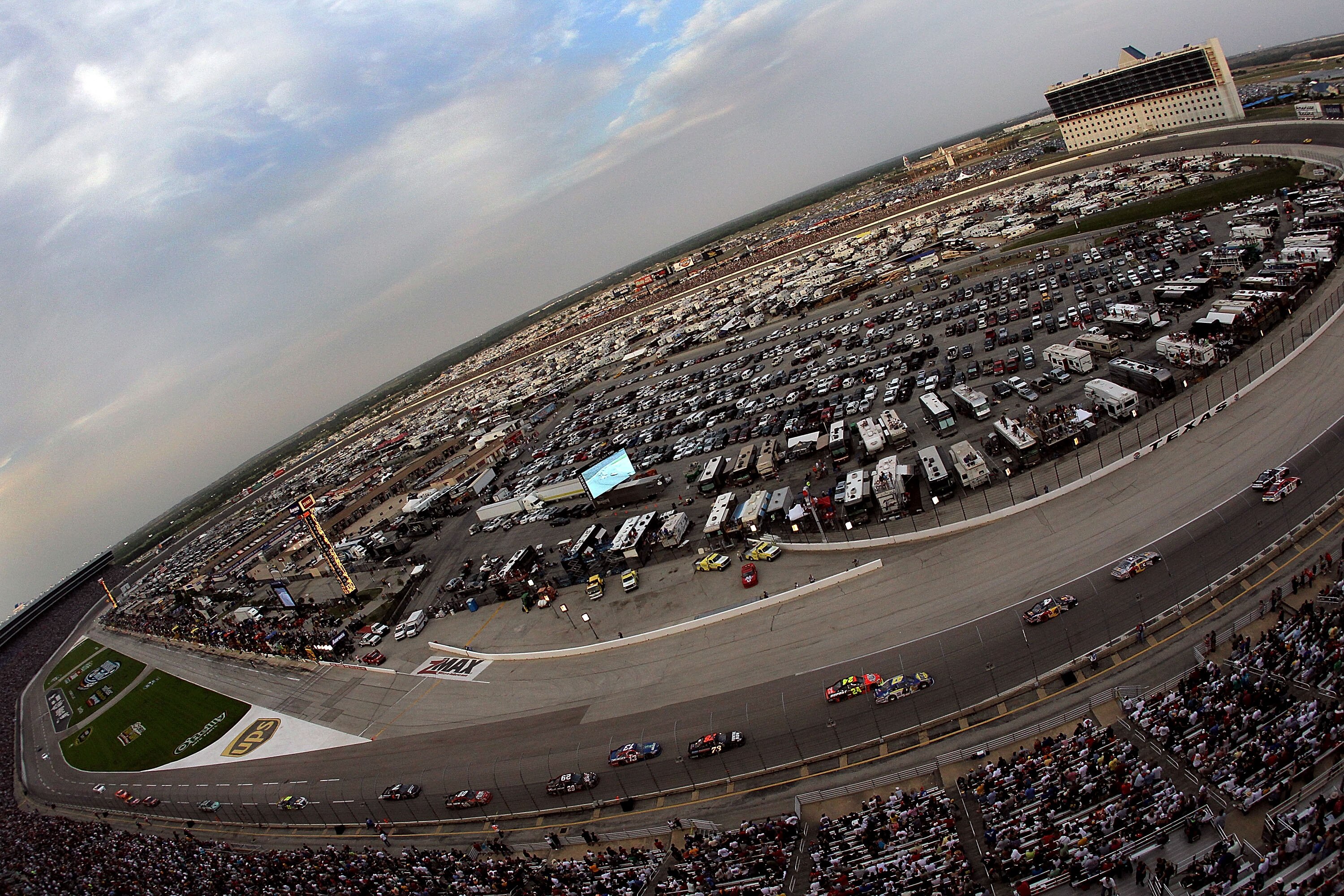 FORT WORTH, TX - APRIL 09:  NASCAR Sprint Cup Series cars race during the NASCAR Sprint Cup Series Samsung Mobile 500 at Texas Motor Speedway on April 9, 2011 in Fort Worth, Texas.  (Photo by Ronald Martinez/Getty Images)