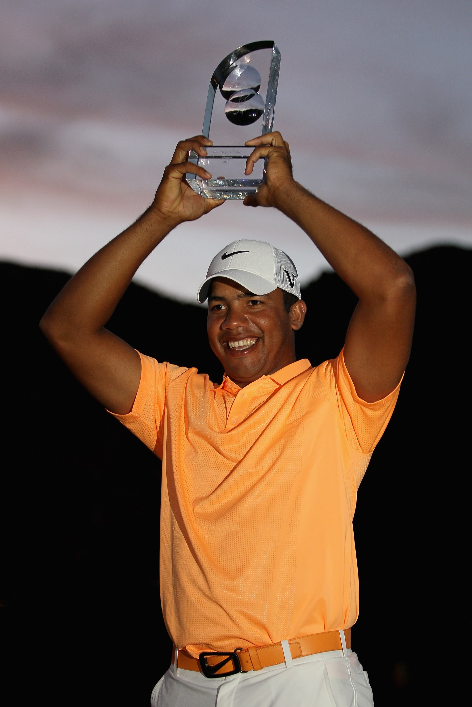 LA QUINTA, CA - JANUARY 23:  Jhonattan Vegas of Venezuela poses with the trophy after winning the Bob Hope Classic at the Palmer Private course at PGA West on January 23, 2011 in La Quinta, California.  (Photo by Jeff Gross/Getty Images)