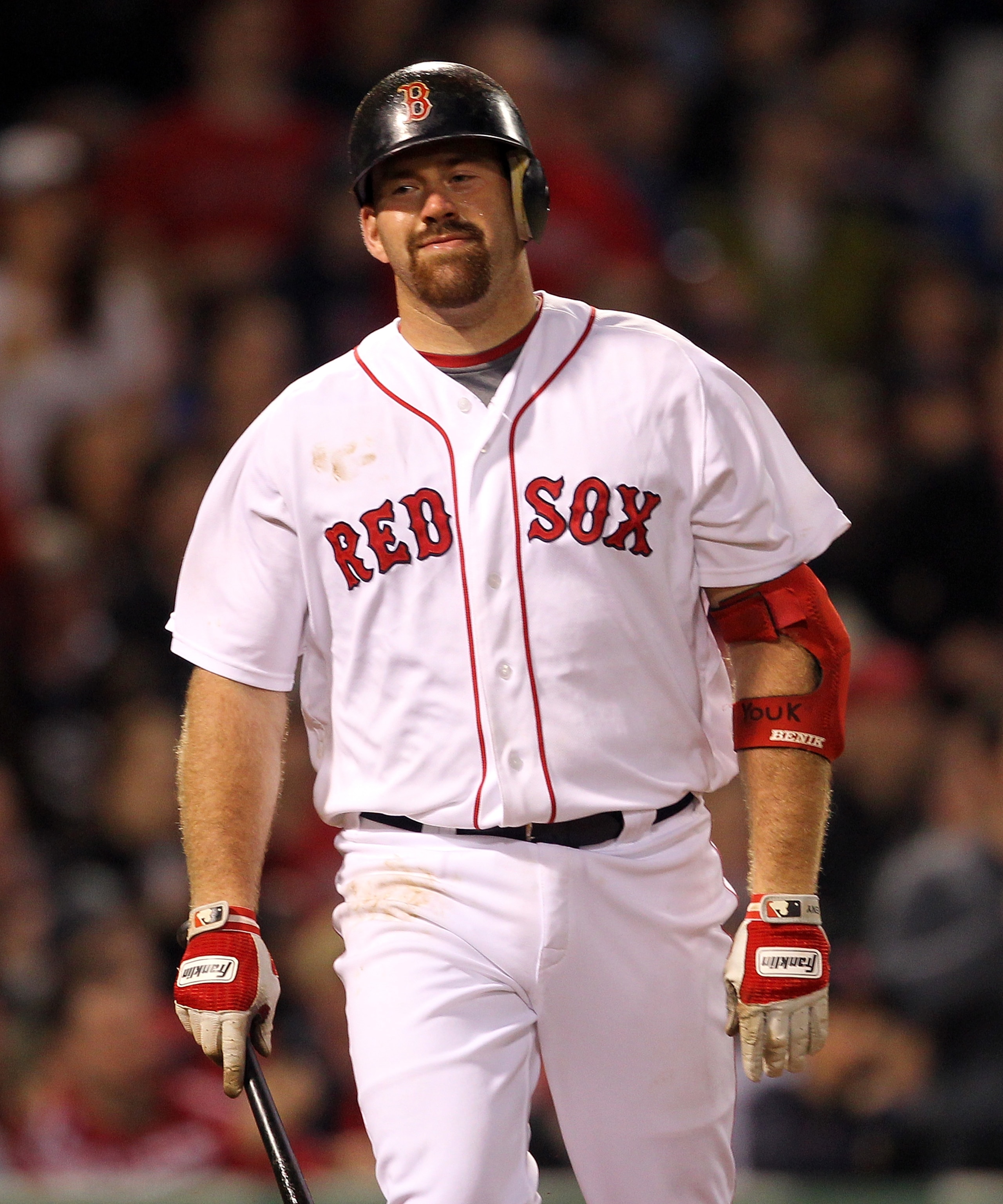 BOSTON, MA - APRIL 11:  Kevin Youkilis #20 of the Boston Red Sox reacts after he hit into a double play in the seventh inning against the Tampa Bay Rays at Fenway Park April 11, 2011 in Boston, Massachusetts. (Photo by Jim Rogash/Getty Images)