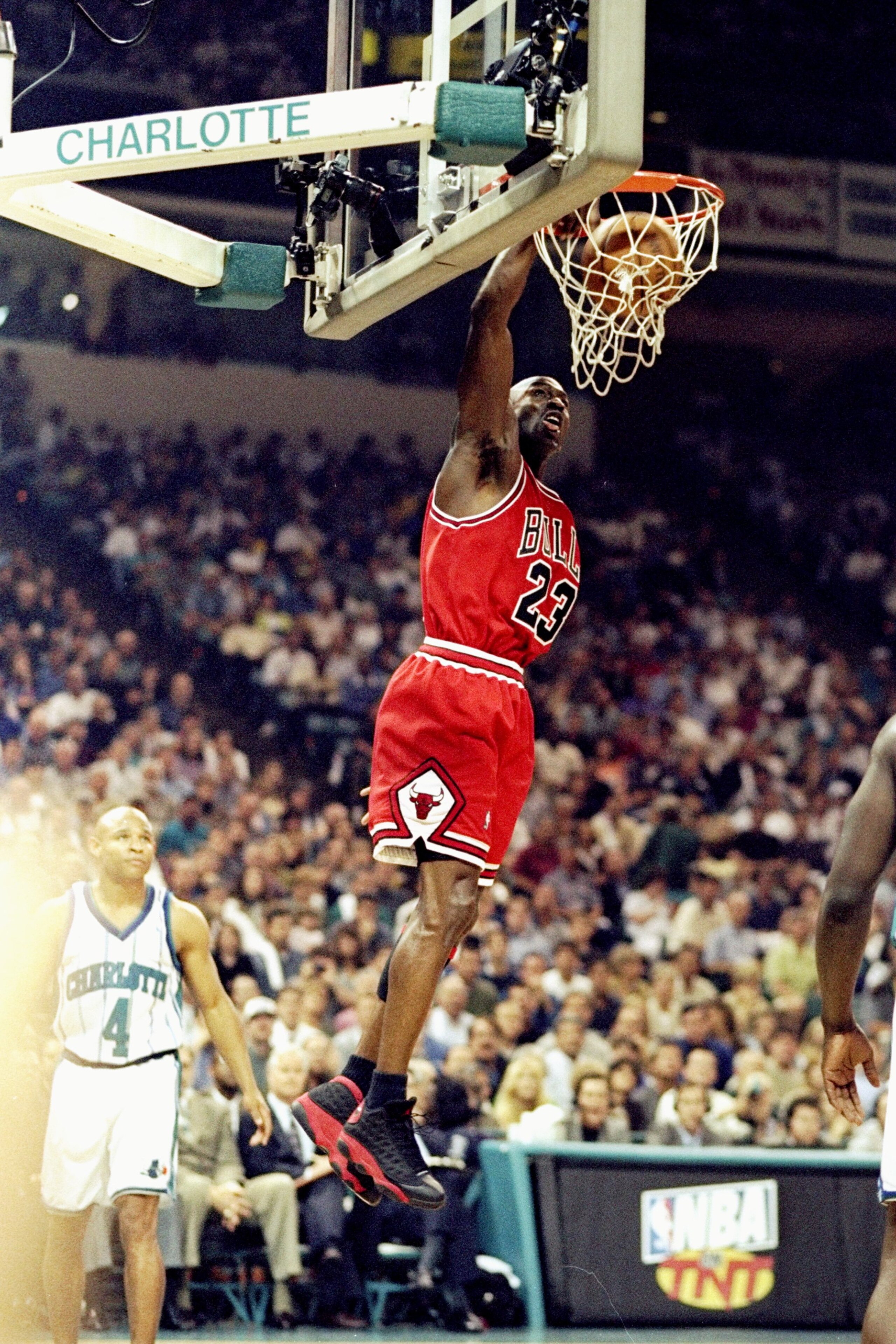 8 May 1998: Michael Jordan #23 of the Chicago Bulls jumps slam dunk during the Eastern Conference Semifinals against the Charlotte Hornets at Charlotte Coliseum in Charlotte, North Carolina. The Bulls defeated the Hornets 103-89Mandatory Credit: Erik Pere 8 May 1998: Michael Jordan #23 of the Chicago Bulls jumps slam dunk during the Eastern Conference Semifinals against the Charlotte Hornets at Charlotte Coliseum in Charlotte, North Carolina. The Bulls defeated the Hornets 103-89Mandatory Credit: Erik Pere