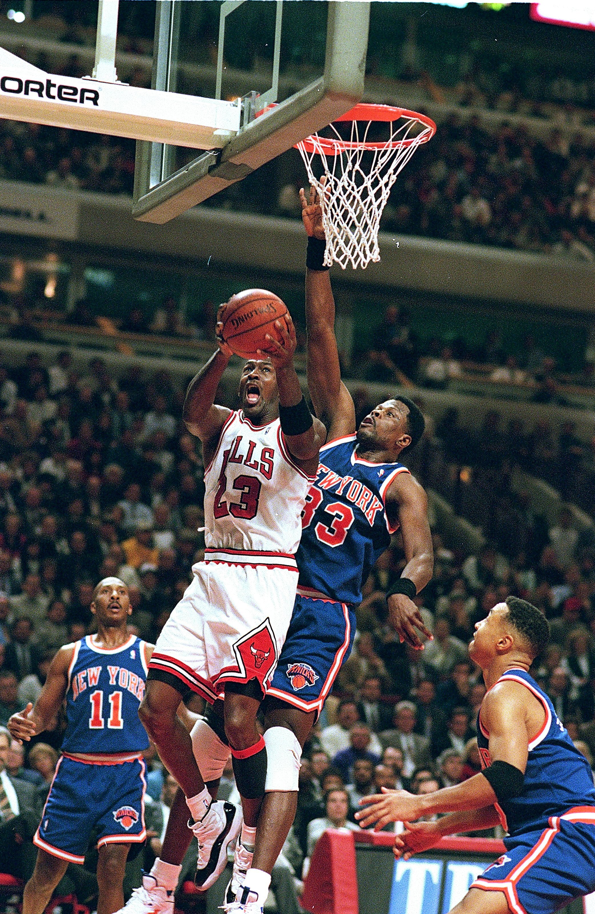 6 Dec 1995:  Michael Jordan #23 of the Chicago Bulls makes a lay-up as Patrick Ewing #33 of the New York Knicks tries to block at the United Center in Chicago,Illinois. The Bulls defeated the Knicks 101-94. NOTE TO USER: It is expressly understood that th