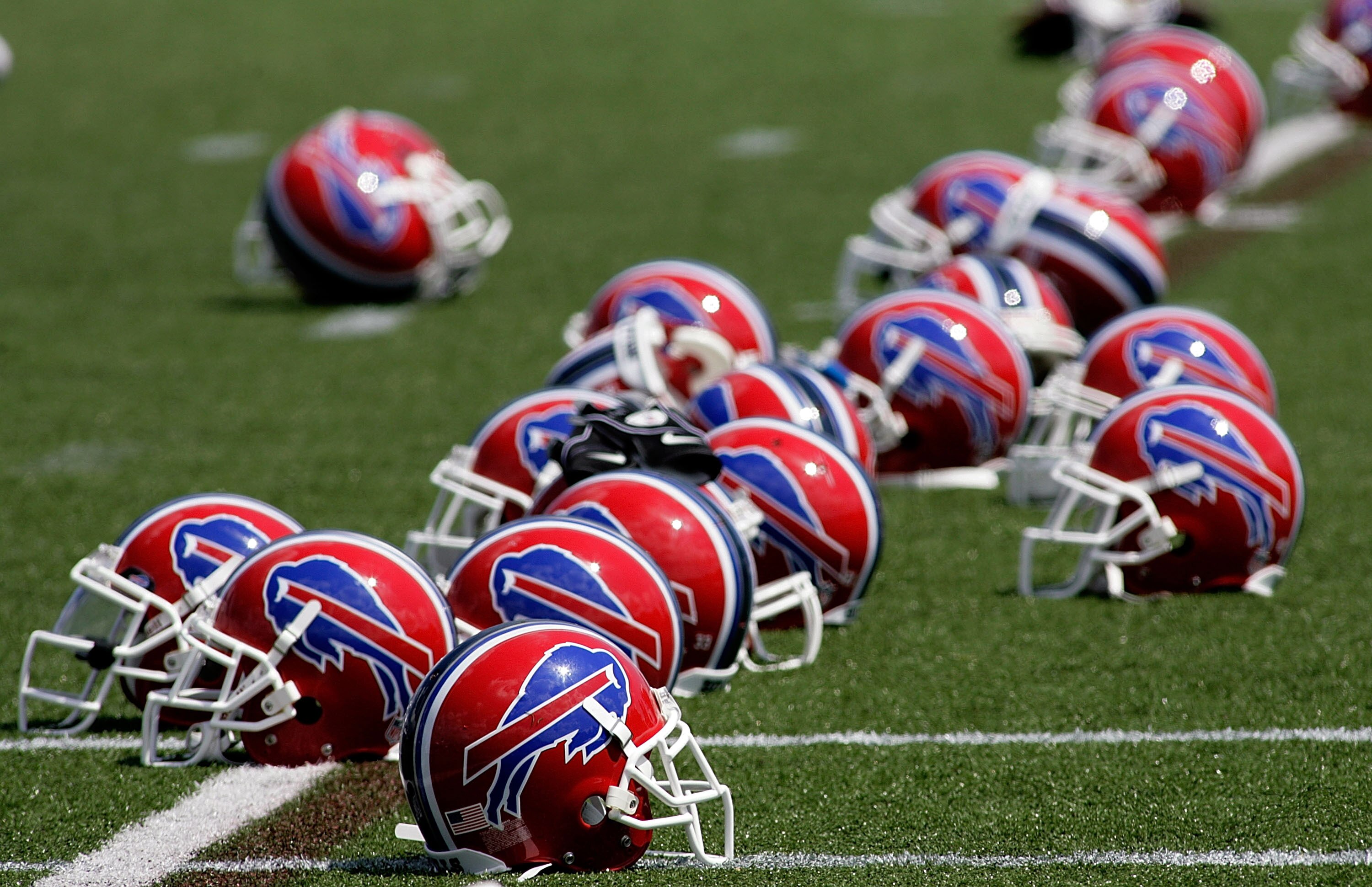 PITTSFORD, NY - JULY 25: Helmets of the Buffalo Bills lay on the field during Training Camp on July 25, 2008 at Saint John Fisher College in Pittsford, New York.  (Photo by Rick Stewart/Getty Images)