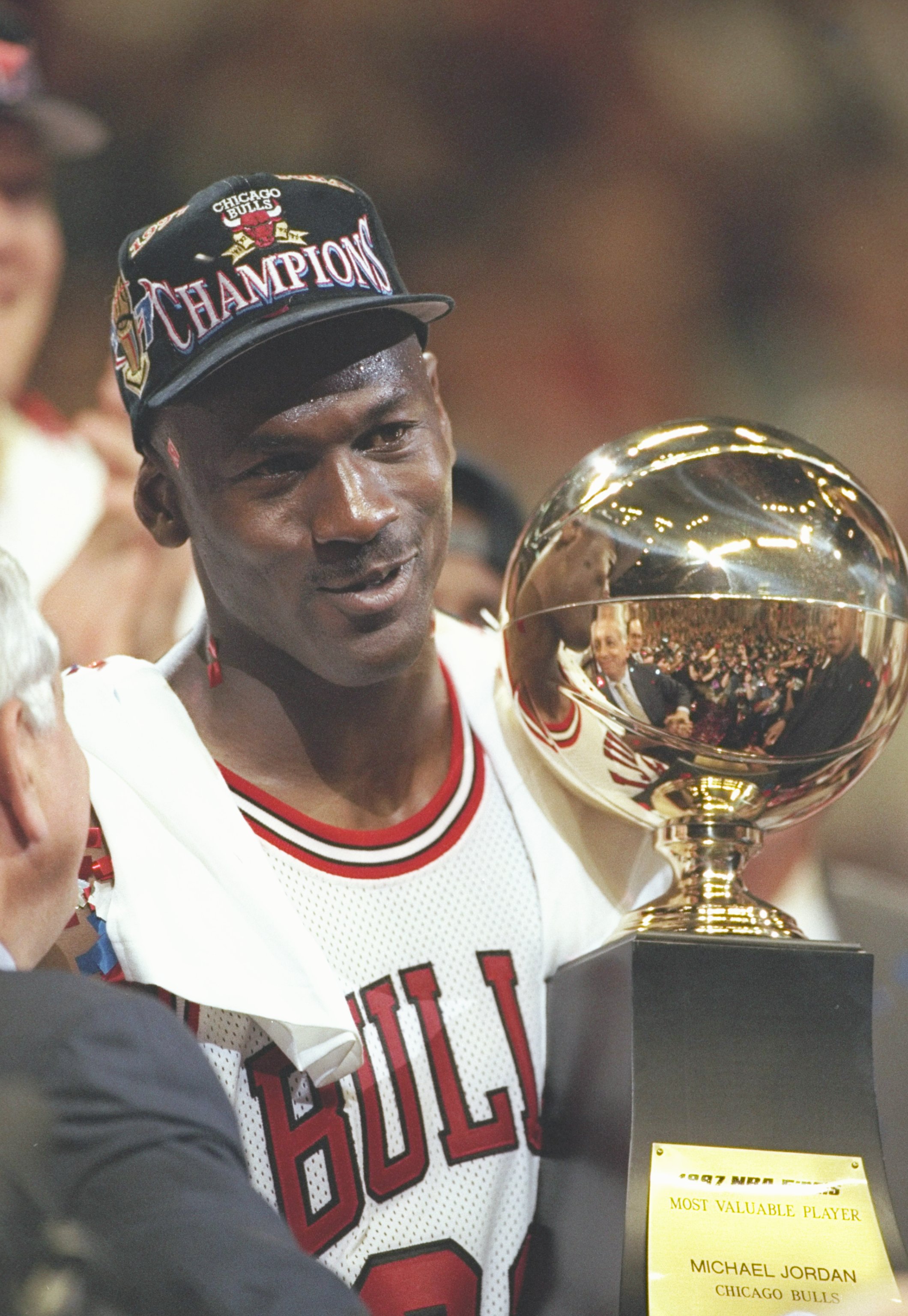 13 Jun 1997:  Michael Jordan of the Chicago Bulls holds the 1998 NBA MVP trophy after the Bulls win game 6 of the 1997 NBA Finals at the United Center in Chicago, Illinois. The Bulls defeated the Jazz 90-86 to win the series and claim the championship. Ma