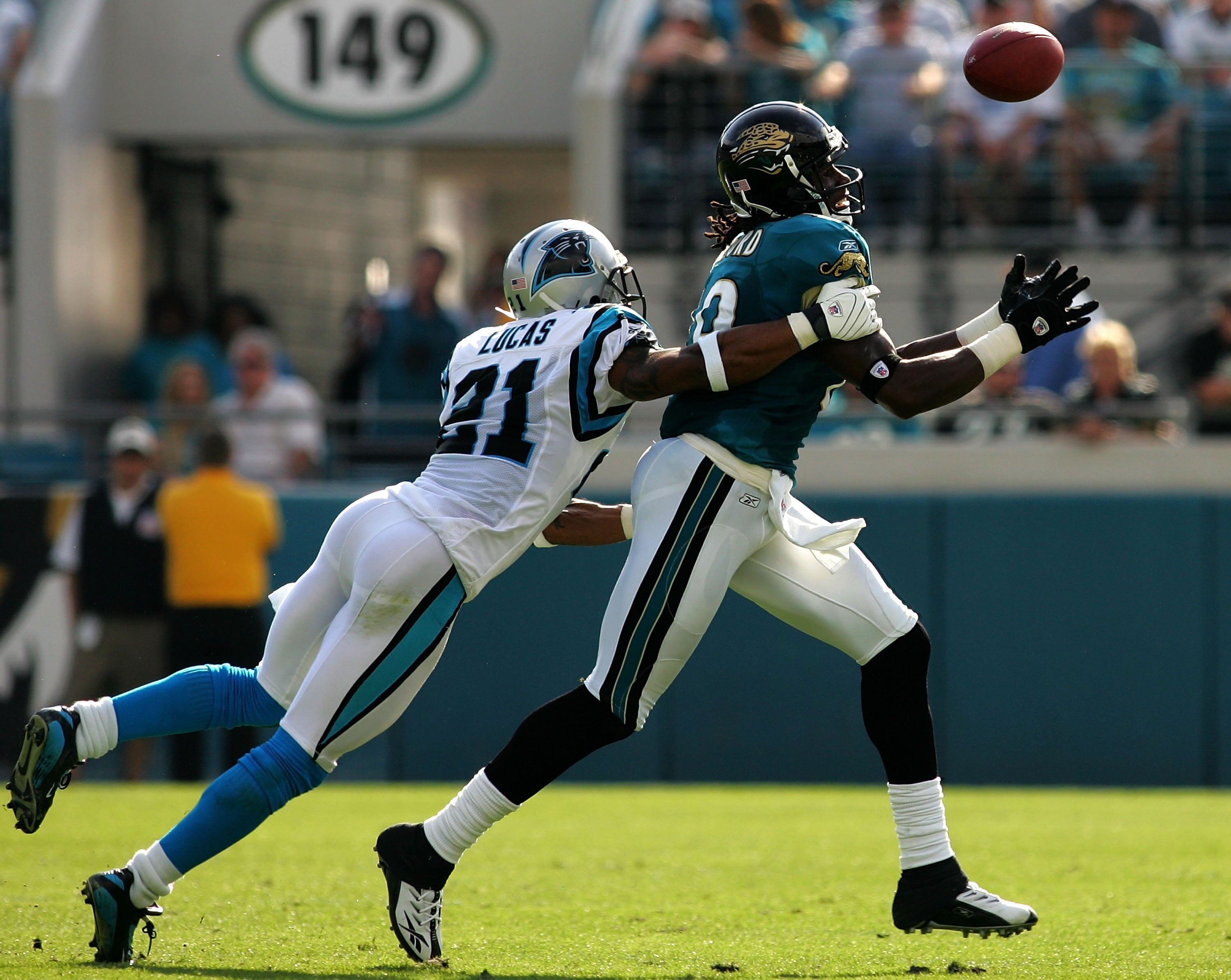 JACKSONVILLE, FL - DECEMBER 09:  Ken Lucas #21 of the Carolina Panthers defends a pass to Ernest Wilford #19 of the Jacksonville Jaguars at Jacksonville Municipal Stadium on December 9, 2007 in Jacksonville, Florida.  The Jaguars beat the Panthers 37-6.
