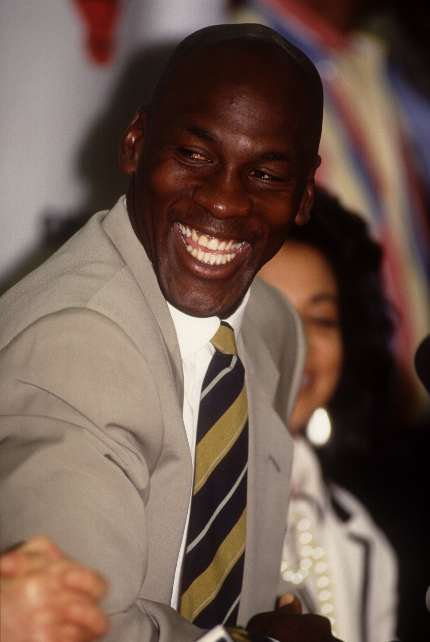 Michael Jordan laughs during the press conference announcing his retirement from the NBA Chicago Bulls. Mandatory Credit: Jonathan Daniel/ALLSPORT