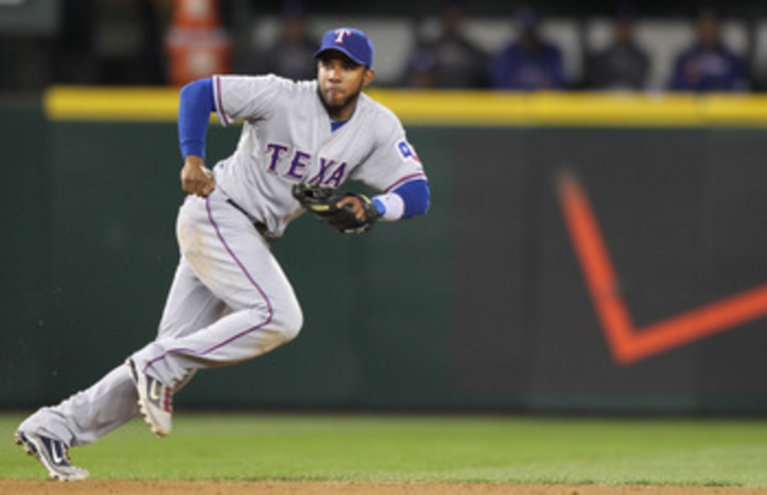 SEATTLE - MAY 04:  Shortstop Elvis Andrus #1 of the Texas Rangers tracks a ground ball against the Seattle Mariners at Safeco Field on May 4, 2011 in Seattle, Washington. (Photo by Otto Greule Jr/Getty Images)