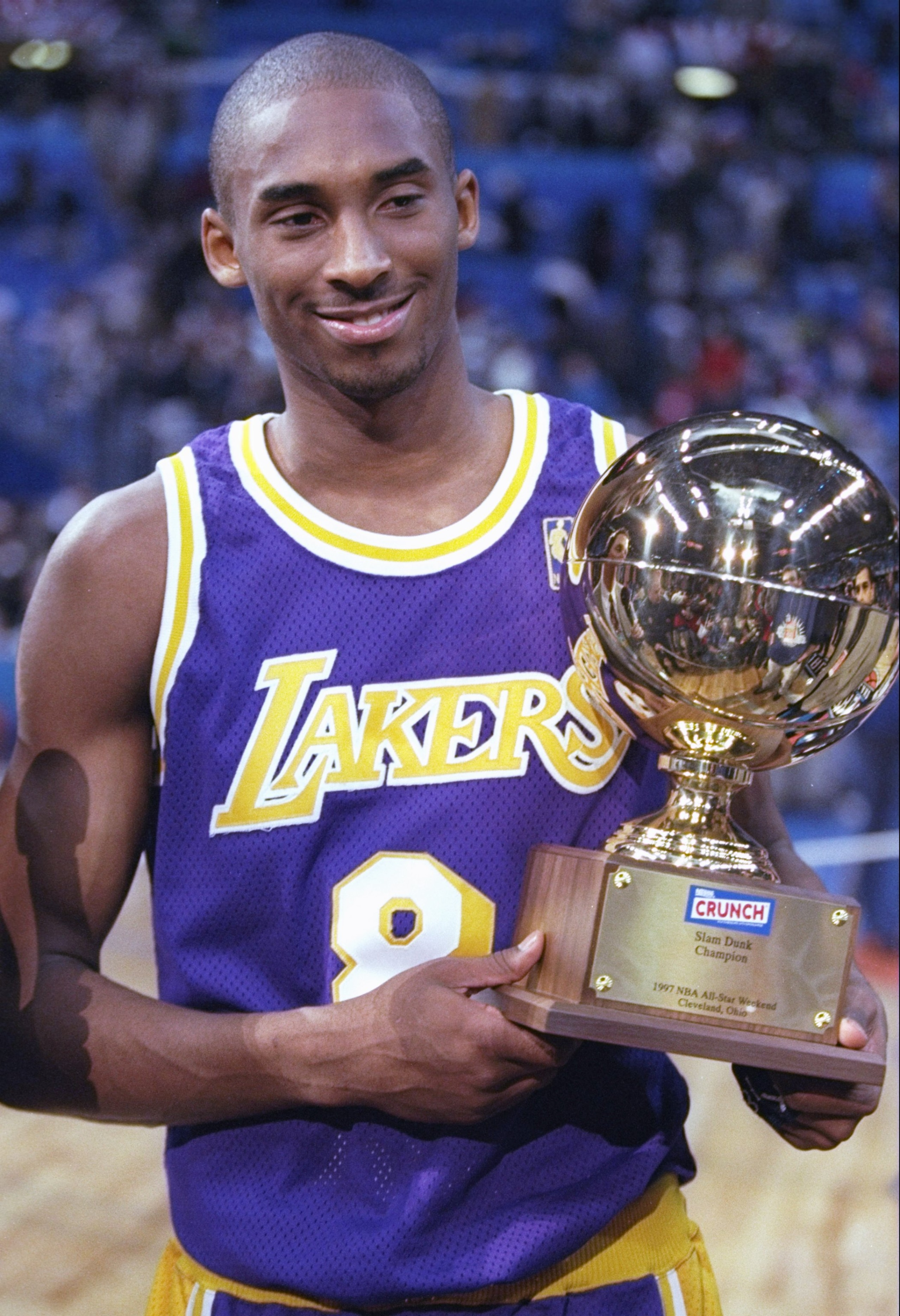 8 Feb 1997: Guard Kobe Bryant of the Los Angeles Lakers holds the Slam Dunk Contest trophy at the Gund Arena in Cleveland, Ohio. Mandatory Credit: Brian Bahr /Allsport 8 Feb 1997: Guard Kobe Bryant of the Los Angeles Lakers holds the Slam Dunk Contest trophy at the Gund Arena in Cleveland, Ohio. Mandatory Credit: Brian Bahr /Allsport