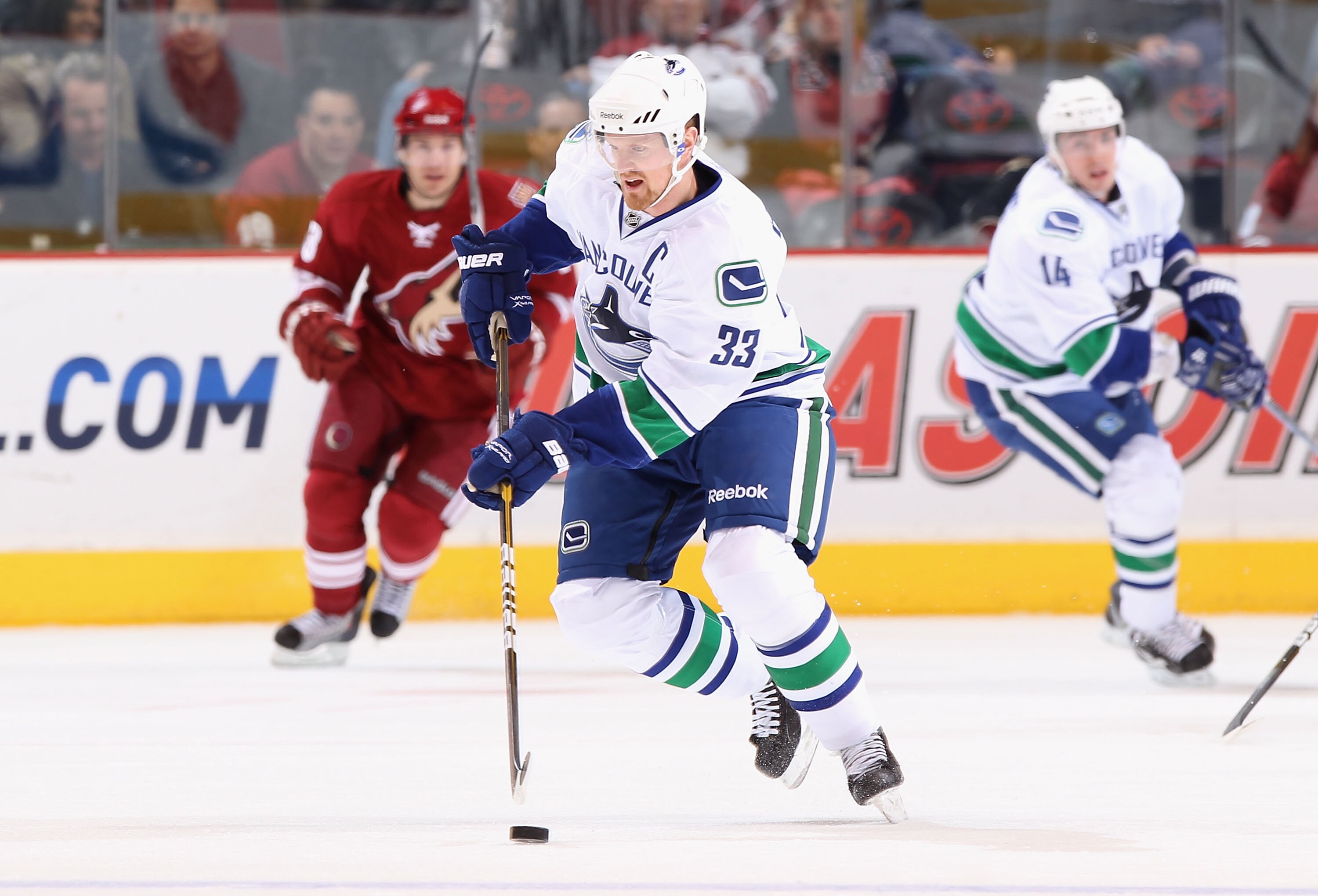 GLENDALE, AZ - FEBRUARY 02:  Henrik Sedin #33 of the Vancouver Canucks skates with the puck during the NHL game against the Phoenix Coyotes at Jobing.com Arena on February 2, 2011 in Glendale, Arizona.  The Canucks defeated the Coyotes 6-0.  (Photo by Chr