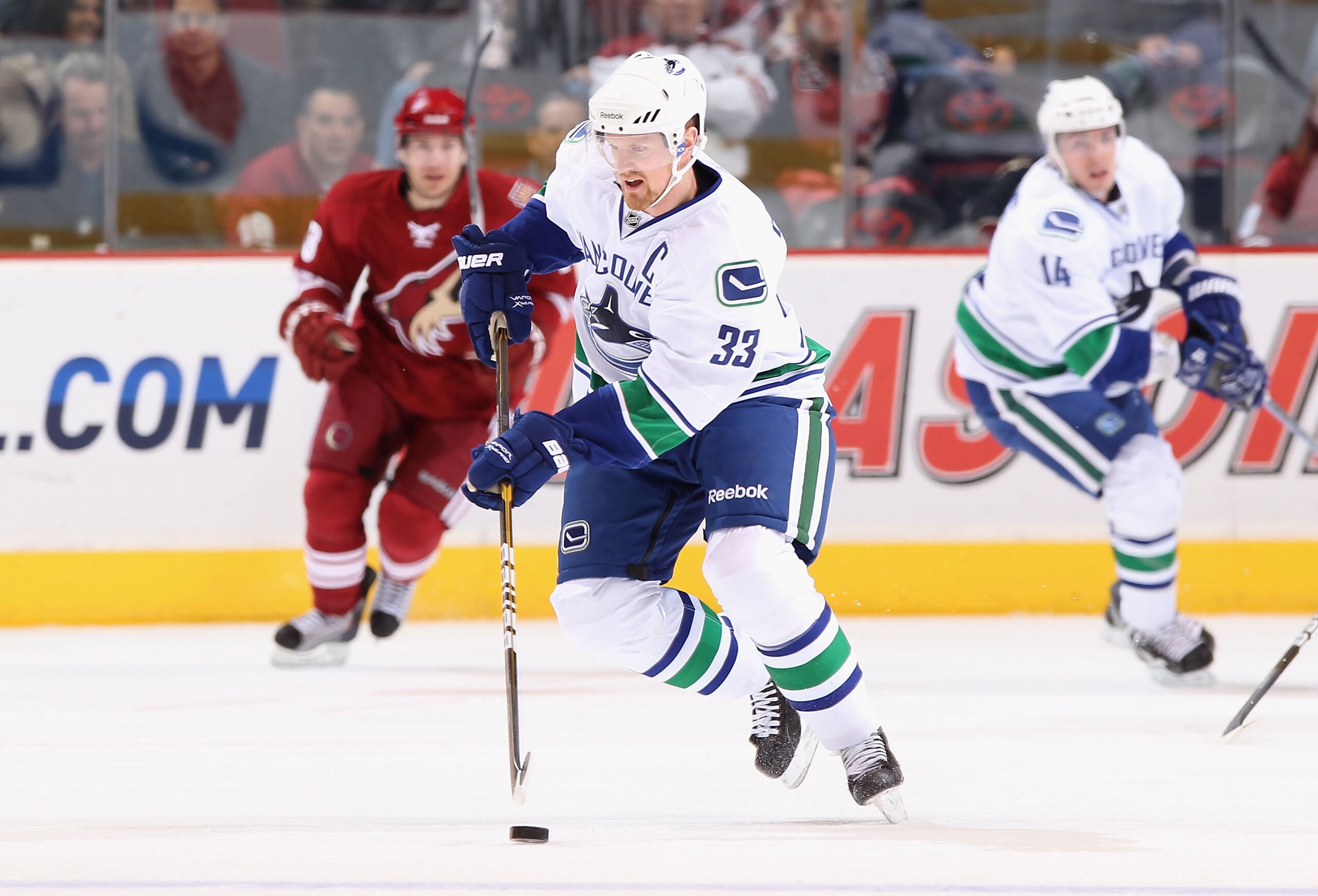 GLENDALE, AZ - FEBRUARY 02:  Henrik Sedin #33 of the Vancouver Canucks skates with the puck during the NHL game against the Phoenix Coyotes at Jobing.com Arena on February 2, 2011 in Glendale, Arizona.  The Canucks defeated the Coyotes 6-0.  (Photo by Chr