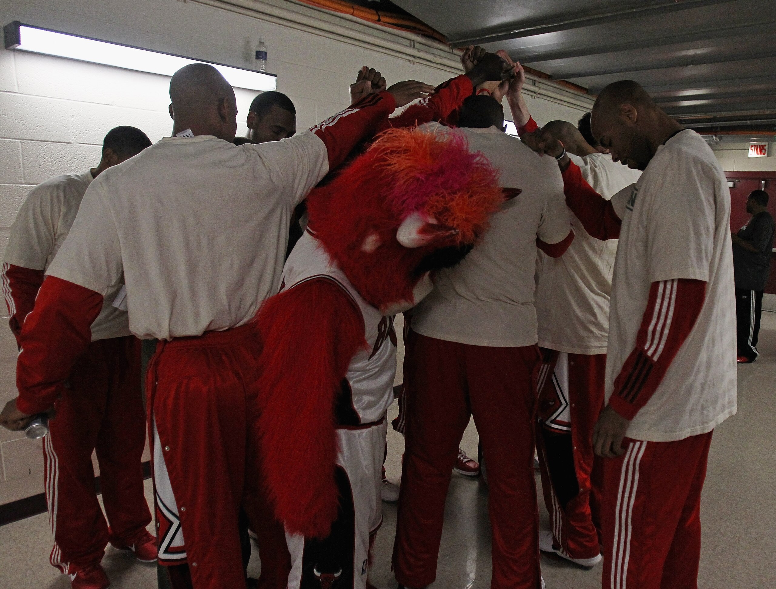 CHICAGO, IL - APRIL 07: Members of the Chicago Bulls including mascot 'Benny,' say a prayer before entering the court for warm-ups for a game against the Boston Celtics at United Center on April 7, 2011 in Chicago, Illinois. NOTE TO USER: User expressly a CHICAGO, IL - APRIL 07: Members of the Chicago Bulls including mascot 'Benny,' say a prayer before entering the court for warm-ups for a game against the Boston Celtics at United Center on April 7, 2011 in Chicago, Illinois. NOTE TO USER: User expressly a