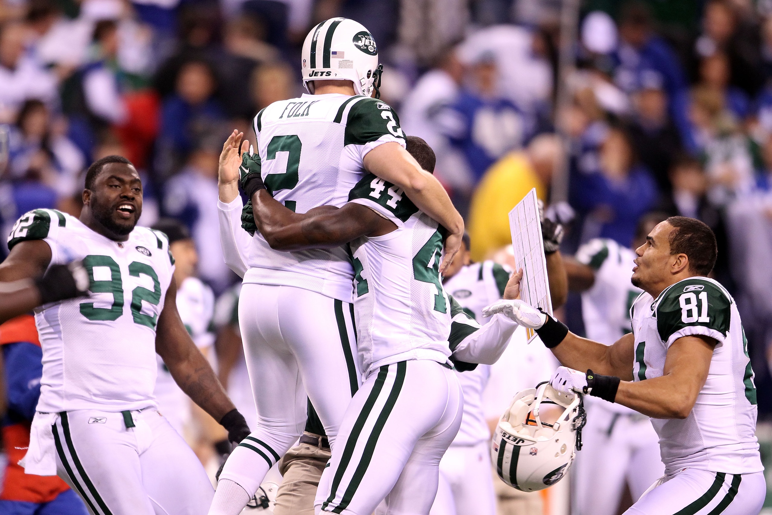 INDIANAPOLIS, IN - JANUARY 08: Place kicker Nick Folk #2 of the New York Jets celebrates with Shaun Ellis #92, James Ihedigbo #44 and Dustin Keller #81 after Folk successfully kicked a game-winning a 32-yard field goal in the fourth quarter to win 17-16 INDIANAPOLIS, IN - JANUARY 08: Place kicker Nick Folk #2 of the New York Jets celebrates with Shaun Ellis #92, James Ihedigbo #44 and Dustin Keller #81 after Folk successfully kicked a game-winning a 32-yard field goal in the fourth quarter to win 17-16