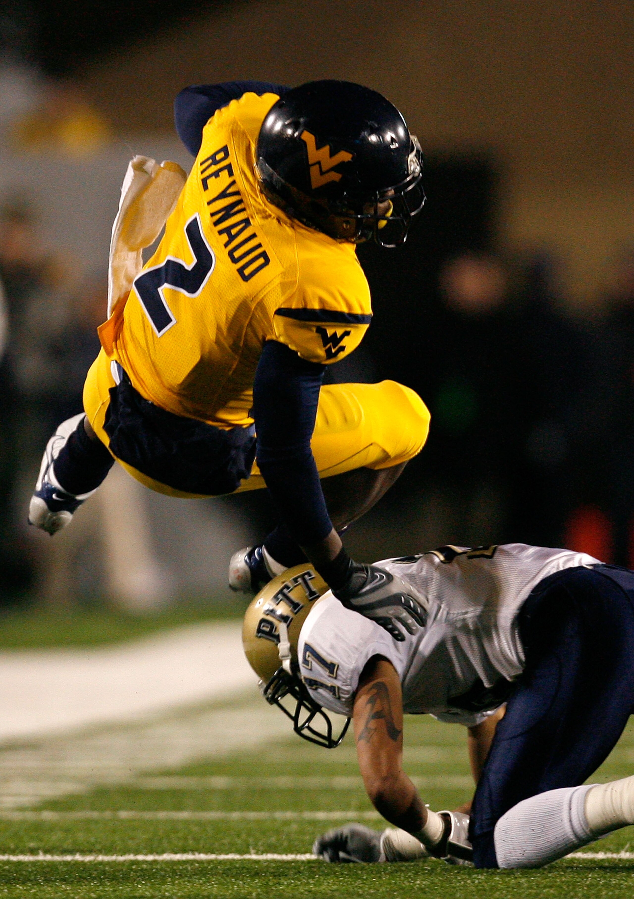 MORGANTOWN, WV - DECEMBER 1: Defensive back Aaron Berry #17 of the Pittsburgh Panthers upends receiver Darius Reynaud # 2 of the West Virginia Mountaineers during the second half at Milan Puskar Stadium December 1, 2007 in Morgantown, West Virginia. Pit MORGANTOWN, WV - DECEMBER 1: Defensive back Aaron Berry #17 of the Pittsburgh Panthers upends receiver Darius Reynaud # 2 of the West Virginia Mountaineers during the second half at Milan Puskar Stadium December 1, 2007 in Morgantown, West Virginia. Pit