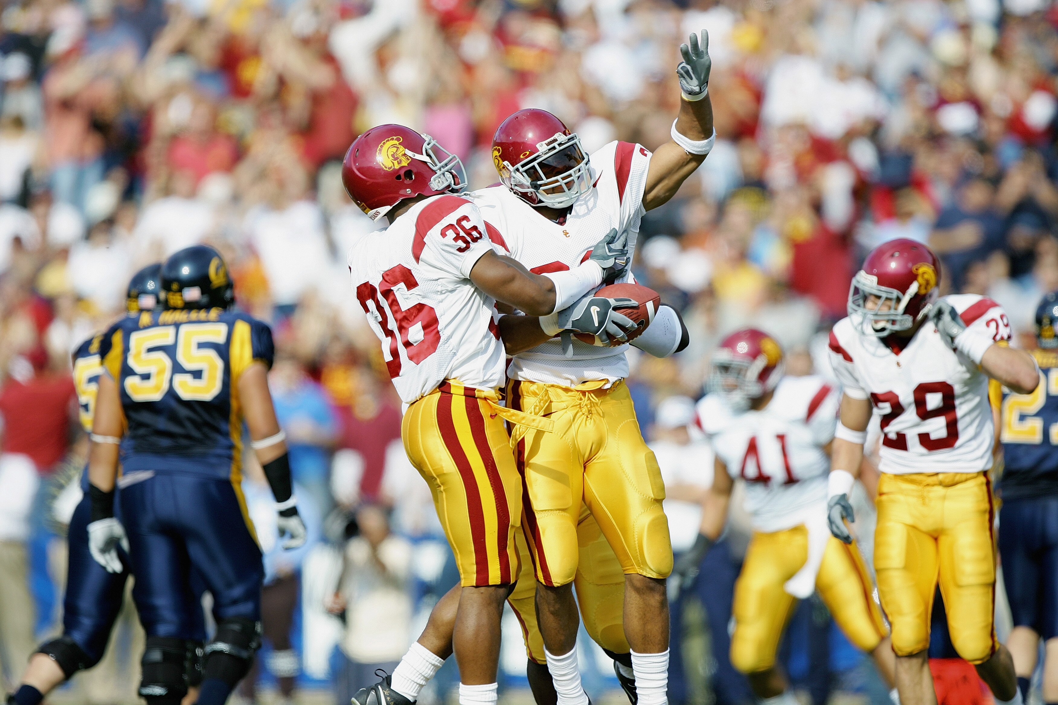 BERKELEY, CA - NOVEMBER 12:  Safety Darnell Bing #20 of the USC Trojans celebrates an interception with cornerback Josh Pinkard #36 against the California Golden Bears at Memorial Stadium on November 12, 2005 in Berkeley, California. The Trojans defeated