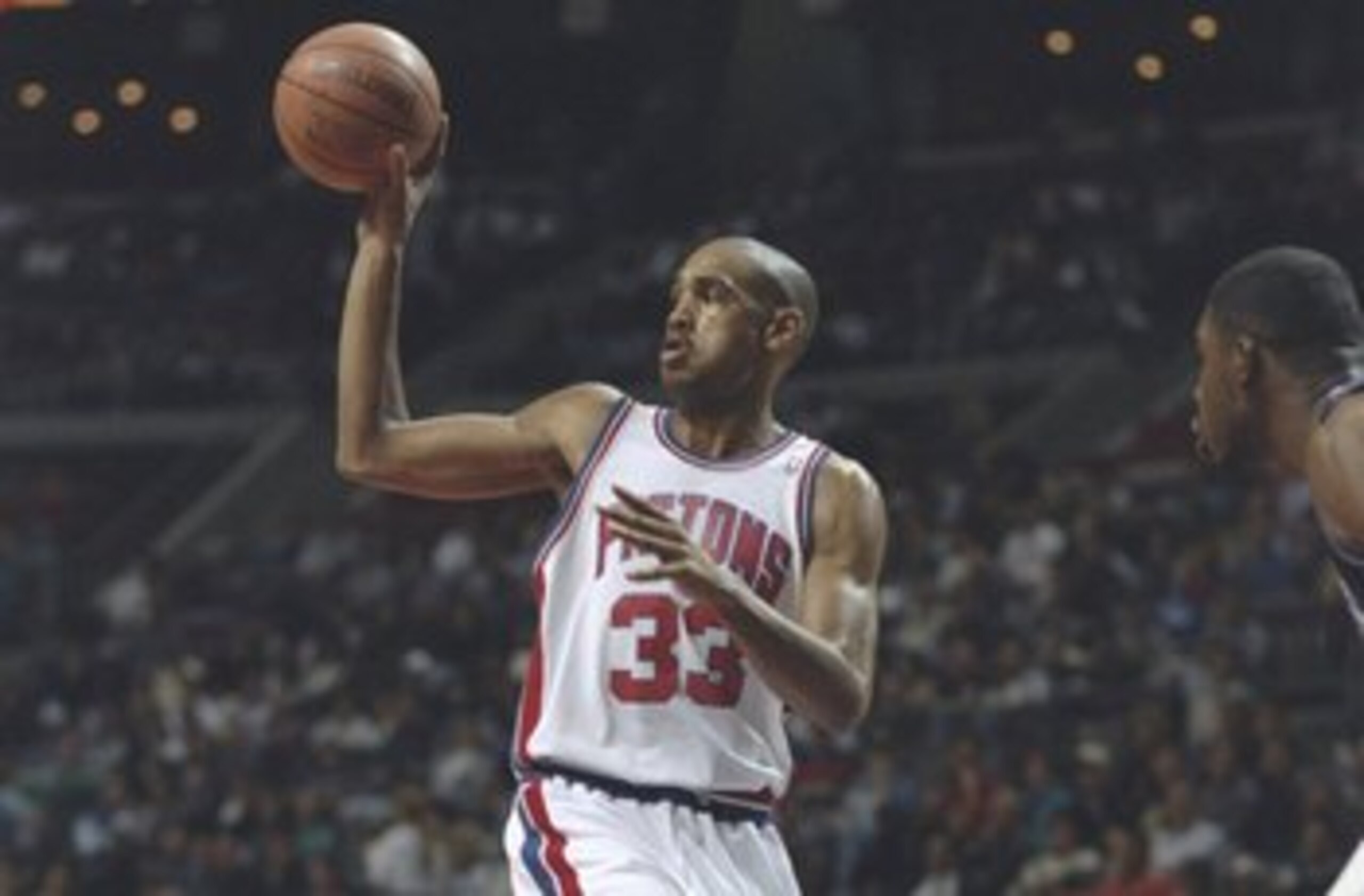 27 Oct 1994:  Forward Grant Hill of the Detroit Pistons dishes off the ball during a game against the Sacramento Kings at the Palace of Auburn Hills in Auburn Hills, Michigan. The Pistons won the game 107-91. Mandatory Credit: Allsport  /Allsport