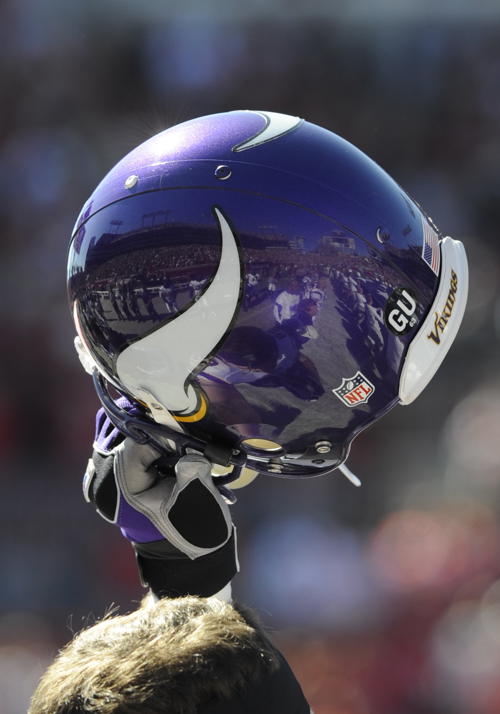 TAMPA, FL - NOVEMBER 16: Defensive end Jared Allen #69 of the Minnesota Vikings holds his helmet high and celebrates a score against the Tampa Bay Buccaneers at Raymond James Stadium on November 16, 2008 in Tampa, Florida.  (Photo by Al Messerschmidt/Gett