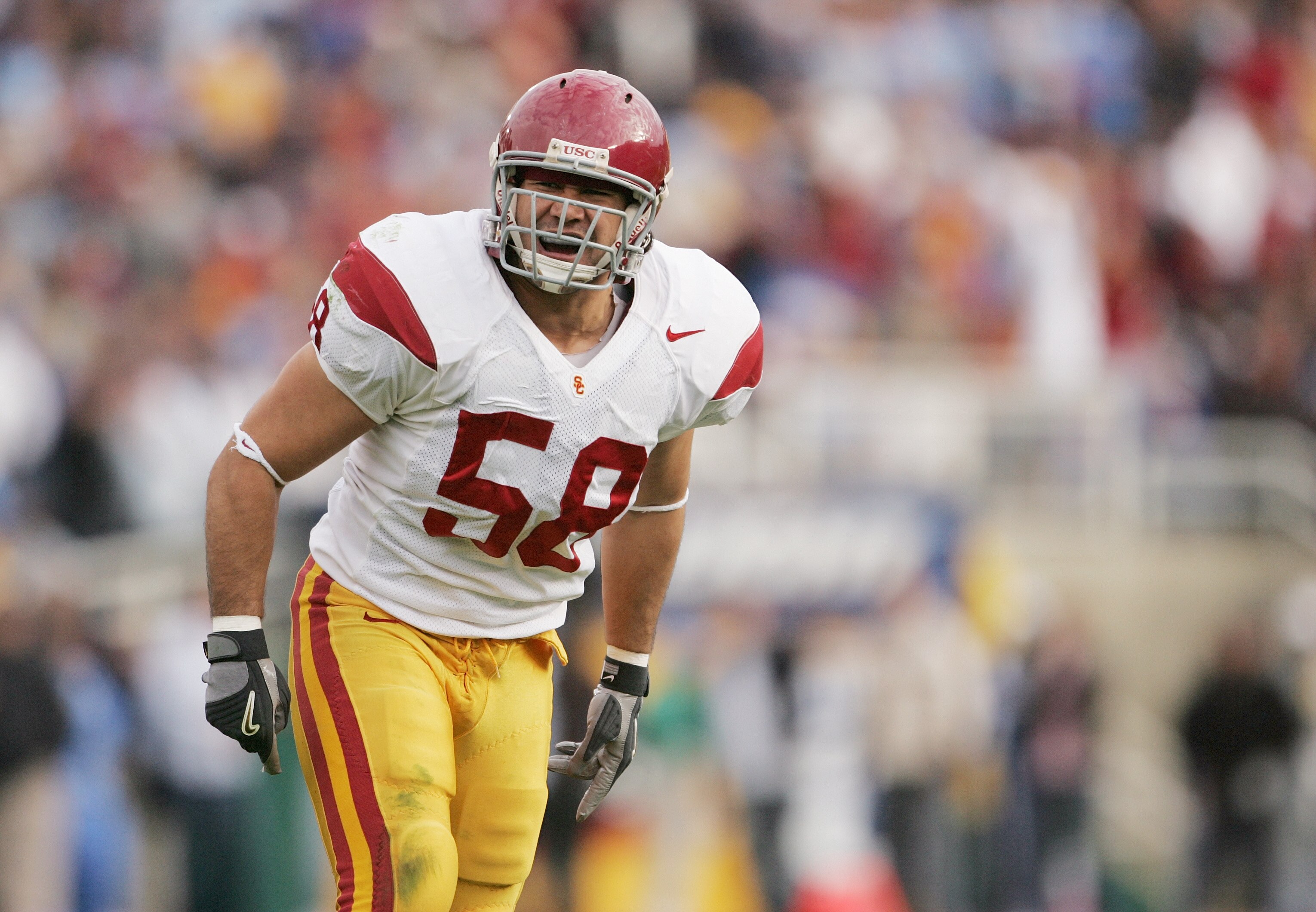 PASADENA, CA - DECEMBER 4:  Lofa Tatupu #58 of the USC Trojans stands on the field during the game against the UCLA Bruins on December 4, 2004 at the Rose Bowl in Pasadena, California (Photo by Jeff Gross/Getty Images)