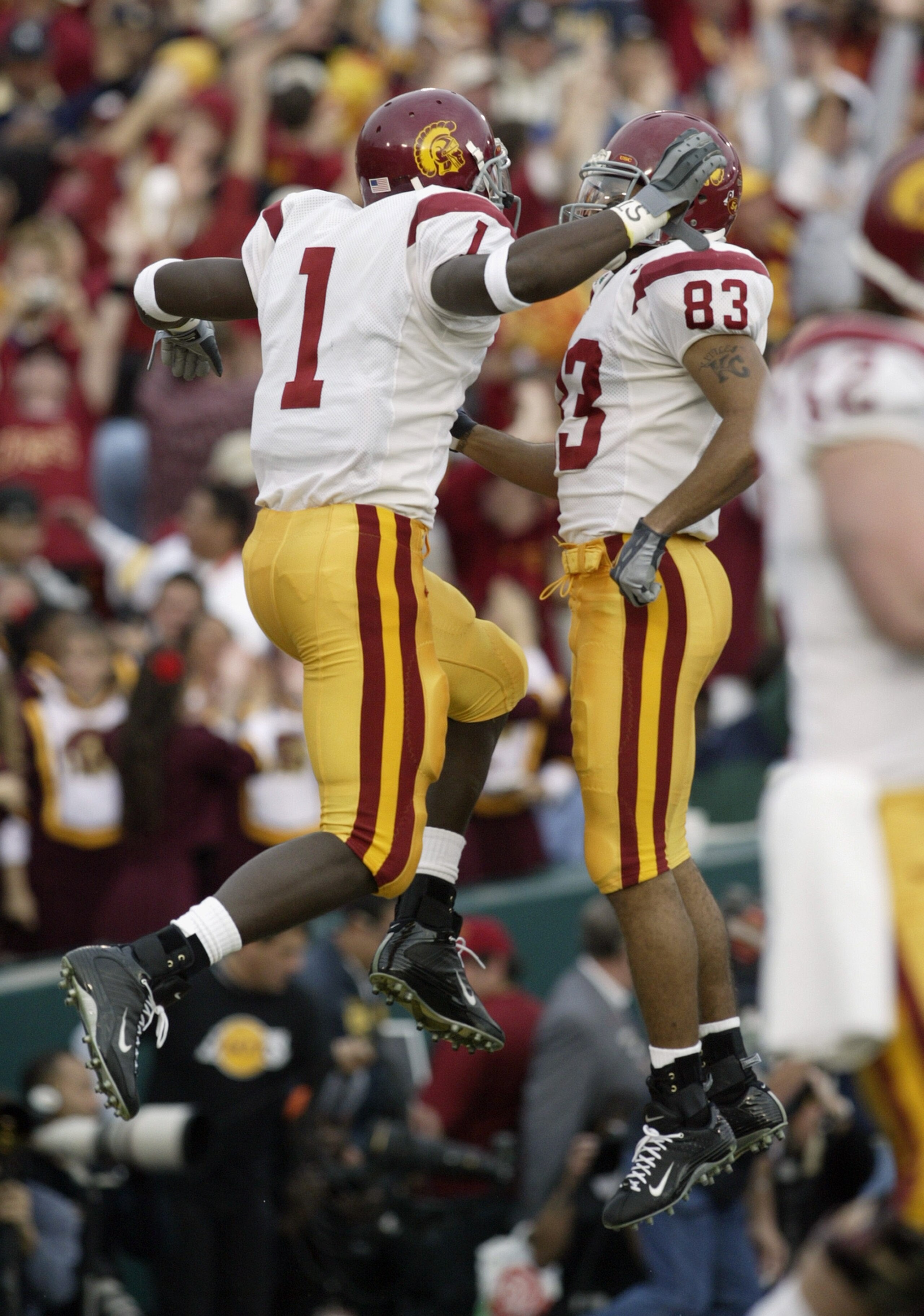PASADENA, CA - JANUARY 1:  Wide receivers Mike Williams #1 and Keary Colbert #83 of the USC Trojans celebrate during the 2004 Rose Bowl game against the Michigan Wolverines on January 1, 2004 at the Rose Bowl in Pasadena, California. USC defeated Michigan