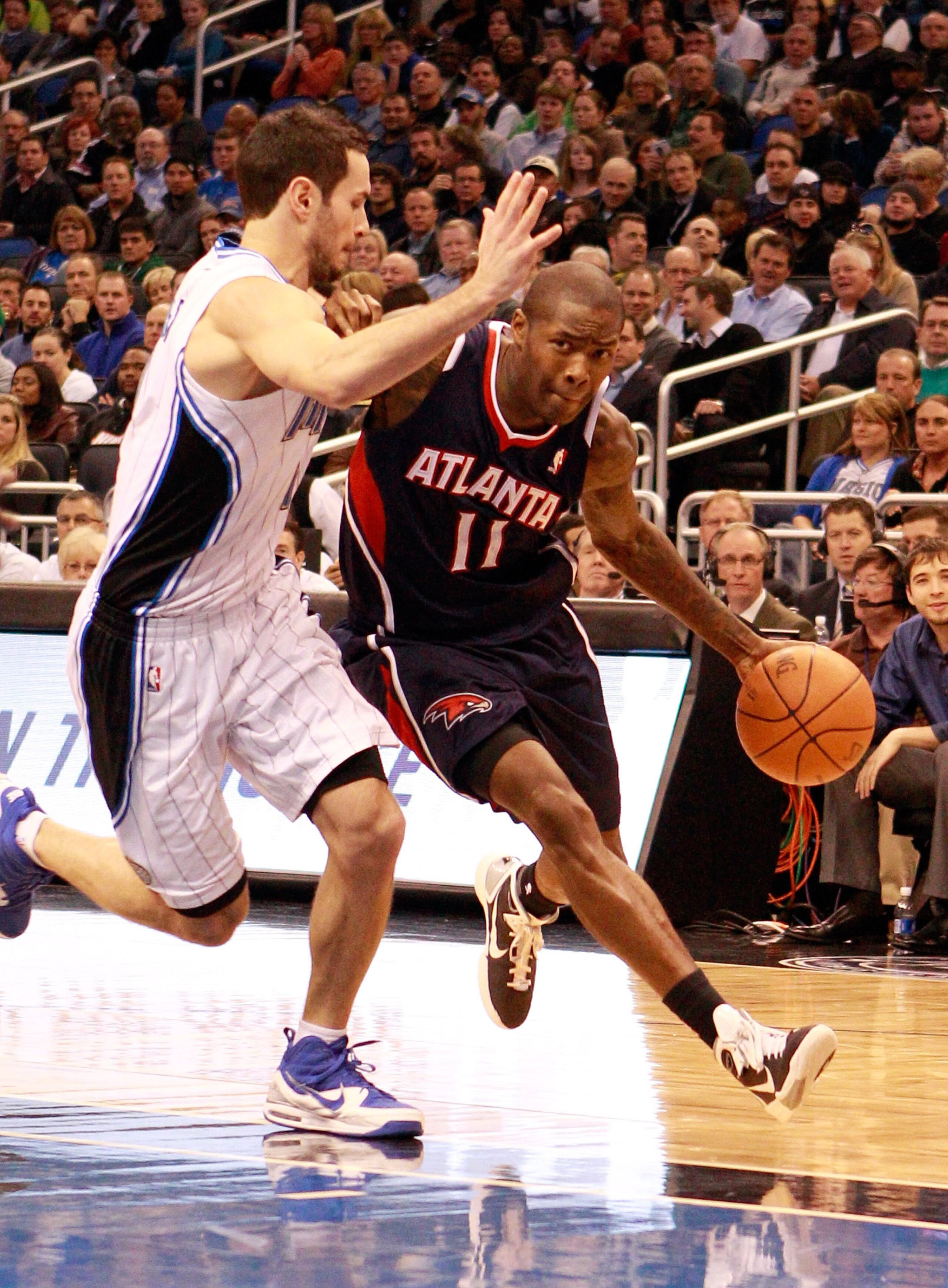 ORLANDO, FL - DECEMBER 06: Jamal Crawford #11 of the Atlanta Hawks drives against J.J. Redick #7 of the Orlando Magic during the game at Amway Arena on December 6, 2010 in Orlando, Florida. NOTE TO USER: User expressly acknowledges and agrees that, by do ORLANDO, FL - DECEMBER 06: Jamal Crawford #11 of the Atlanta Hawks drives against J.J. Redick #7 of the Orlando Magic during the game at Amway Arena on December 6, 2010 in Orlando, Florida. NOTE TO USER: User expressly acknowledges and agrees that, by do