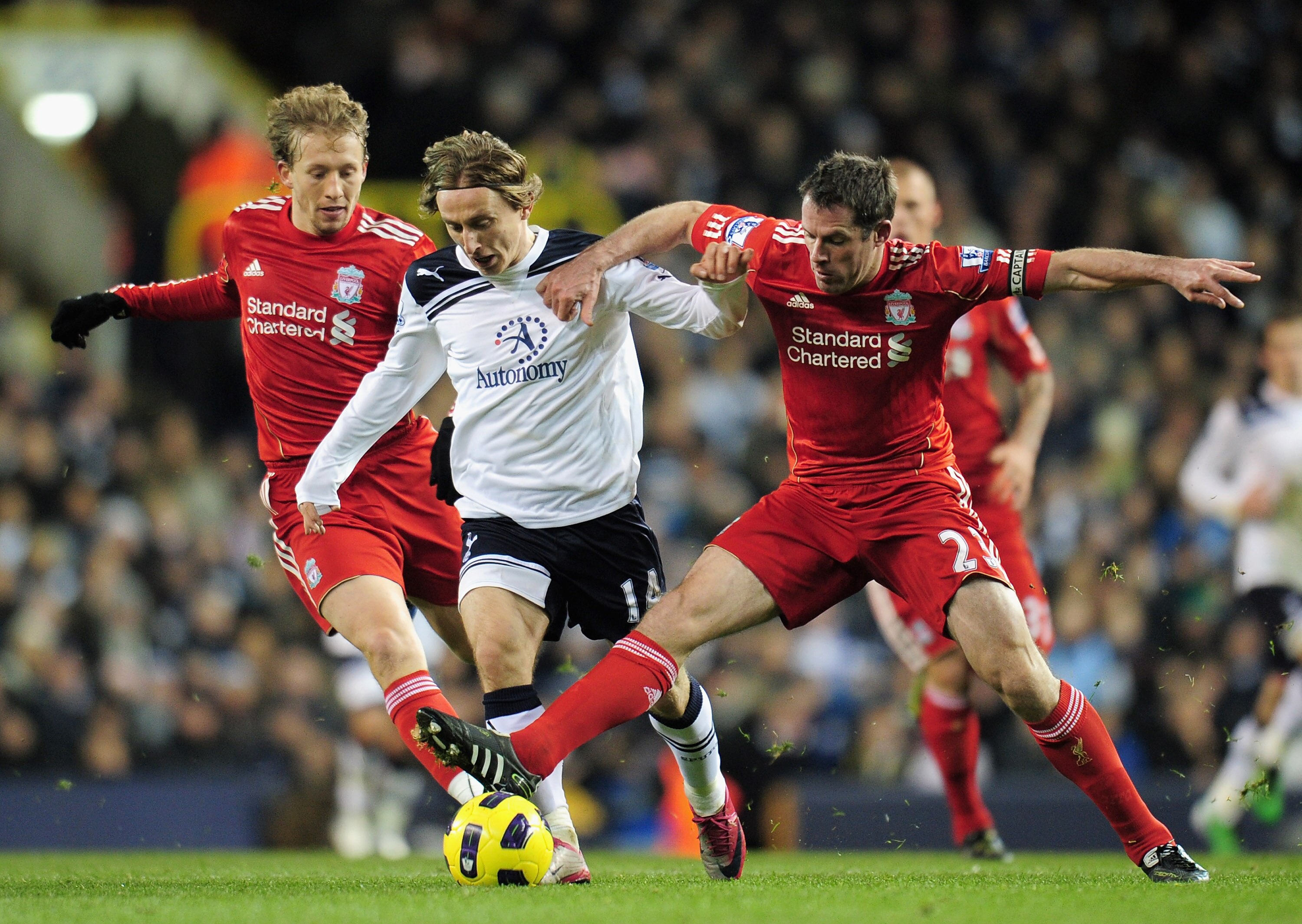 LONDON, ENGLAND - NOVEMBER 28:  Luka Modric of Tottenham Hotspur is tackled by Jamie Carragher of Liverpool during the Barclays Premier League match between Tottenham Hotspur and Liverpool at White Hart Lane on November 28, 2010 in London, England.  (Phot