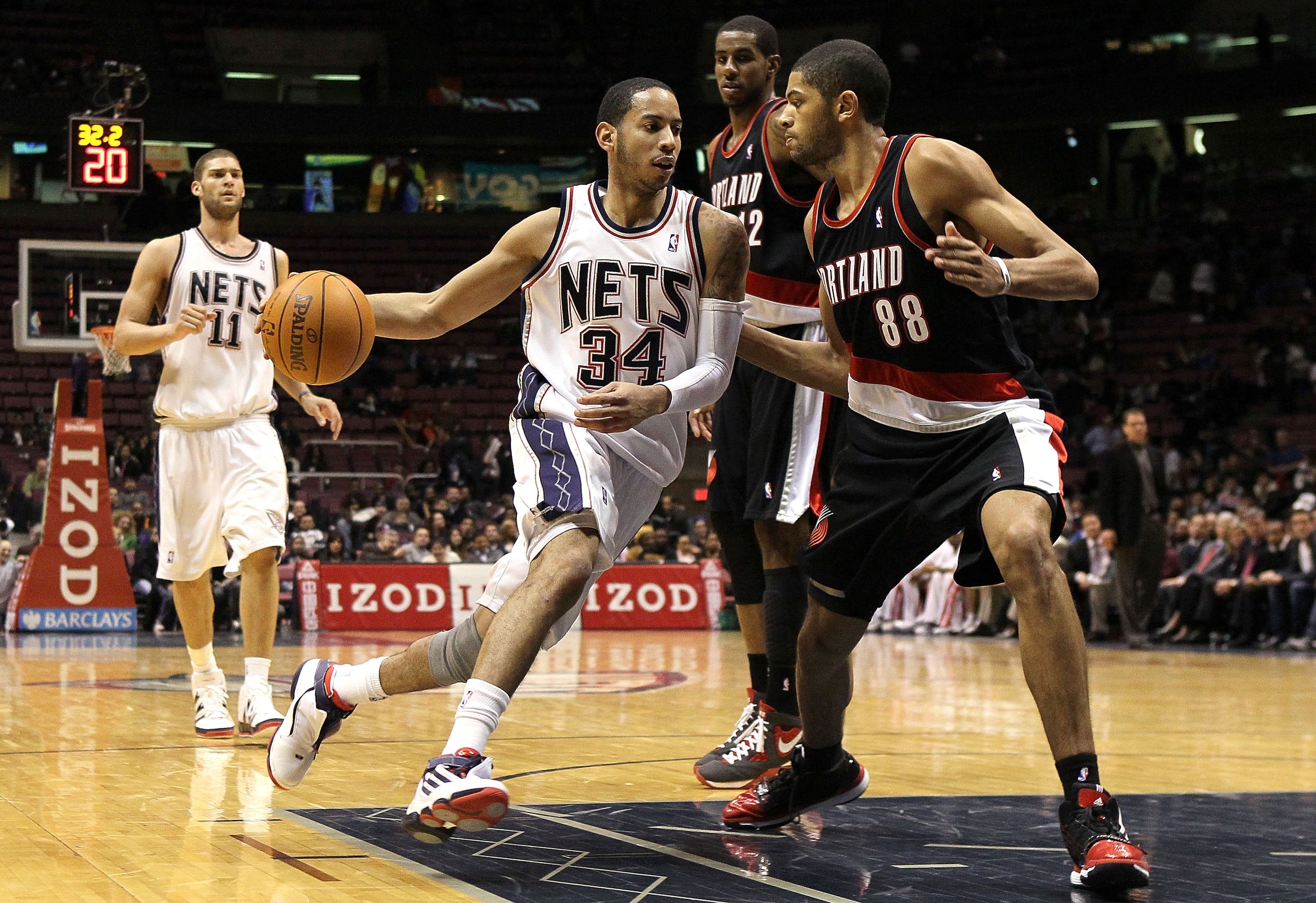 EAST RUTHERFORD, NJ - FEBRUARY 23: Devin Harris #34 of the New Jersey Nets drives against Nicolas Batum #88 of the Portland Trail Blazers at the Izod Center on February 23, 2010 in East Rutherford, New Jersey.The Blazers defeated the Nets 102-93.NOTE TO EAST RUTHERFORD, NJ - FEBRUARY 23: Devin Harris #34 of the New Jersey Nets drives against Nicolas Batum #88 of the Portland Trail Blazers at the Izod Center on February 23, 2010 in East Rutherford, New Jersey.The Blazers defeated the Nets 102-93.NOTE TO