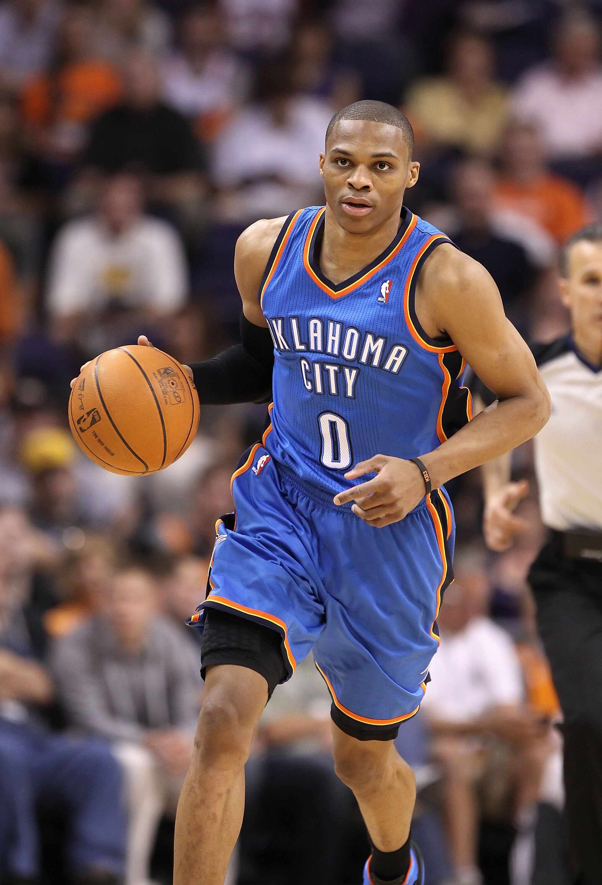 PHOENIX, AZ - MARCH 30:  Russell Westbrook #0 of the Oklahoma City Thunder handles the ball during the NBA game against the Phoenix Suns at US Airways Center on March 30, 2011 in Phoenix, Arizona. The Thunder defeated the Suns 116-98.   NOTE TO USER: User