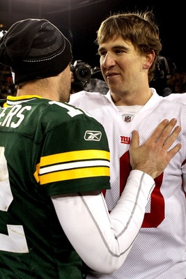 GREEN BAY, WI - DECEMBER 26:  Aaron Rodgers #12 of the Green Bay Packers is congratulated by Eli Manning #10 of the New York Giants after their game at Lambeau Field on December 26, 2010 in Green Bay, Wisconsin.  (Photo by Matthew Stockman/Getty Images)