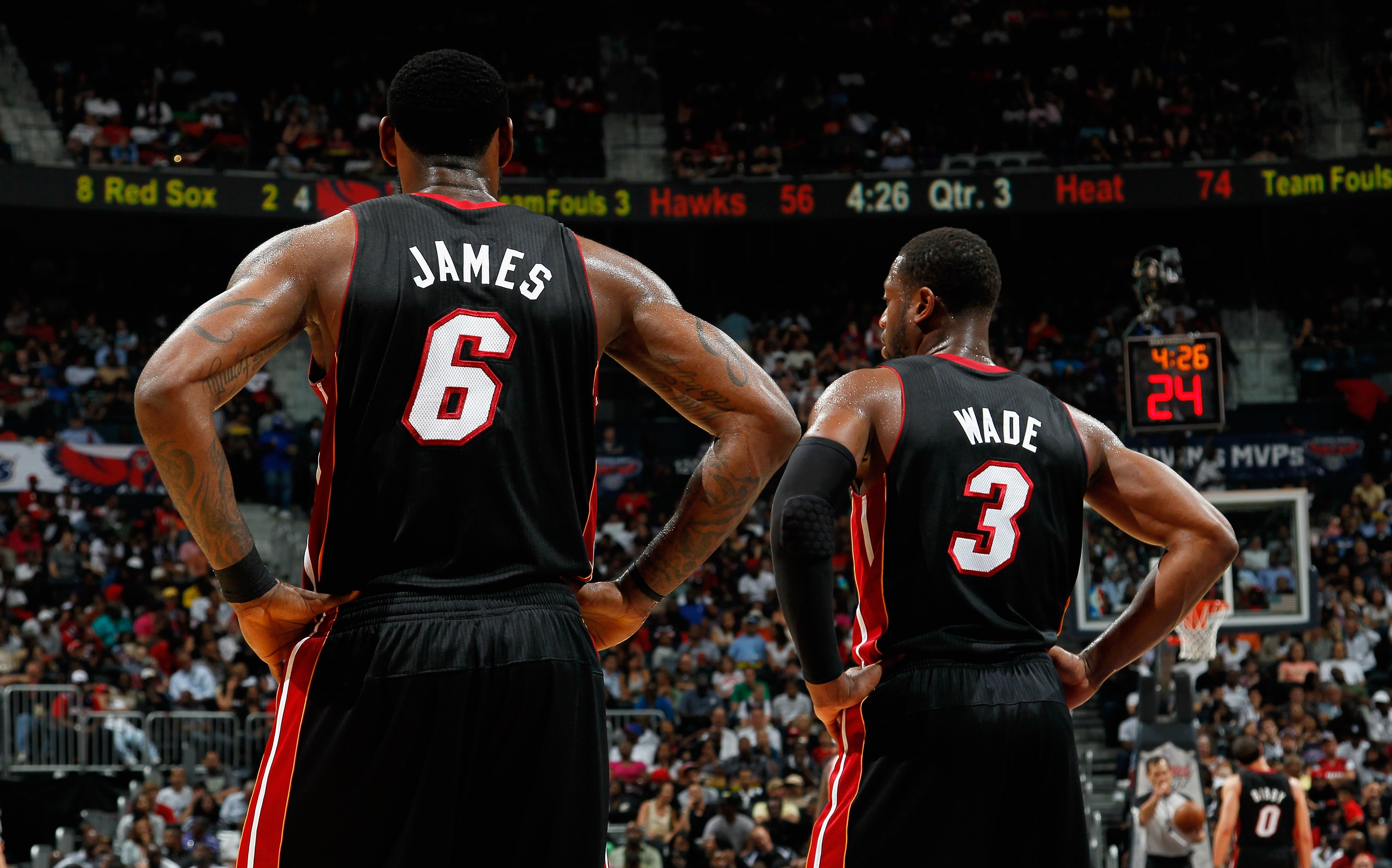 ATLANTA, GA - APRIL 11:  LeBron James #6 and Dwyane Wade #3 of the Miami Heat stand during a free throw against the Atlanta Hawks at Philips Arena on April 11, 2011 in Atlanta, Georgia.  NOTE TO USER: User expressly acknowledges and agrees that, by downlo