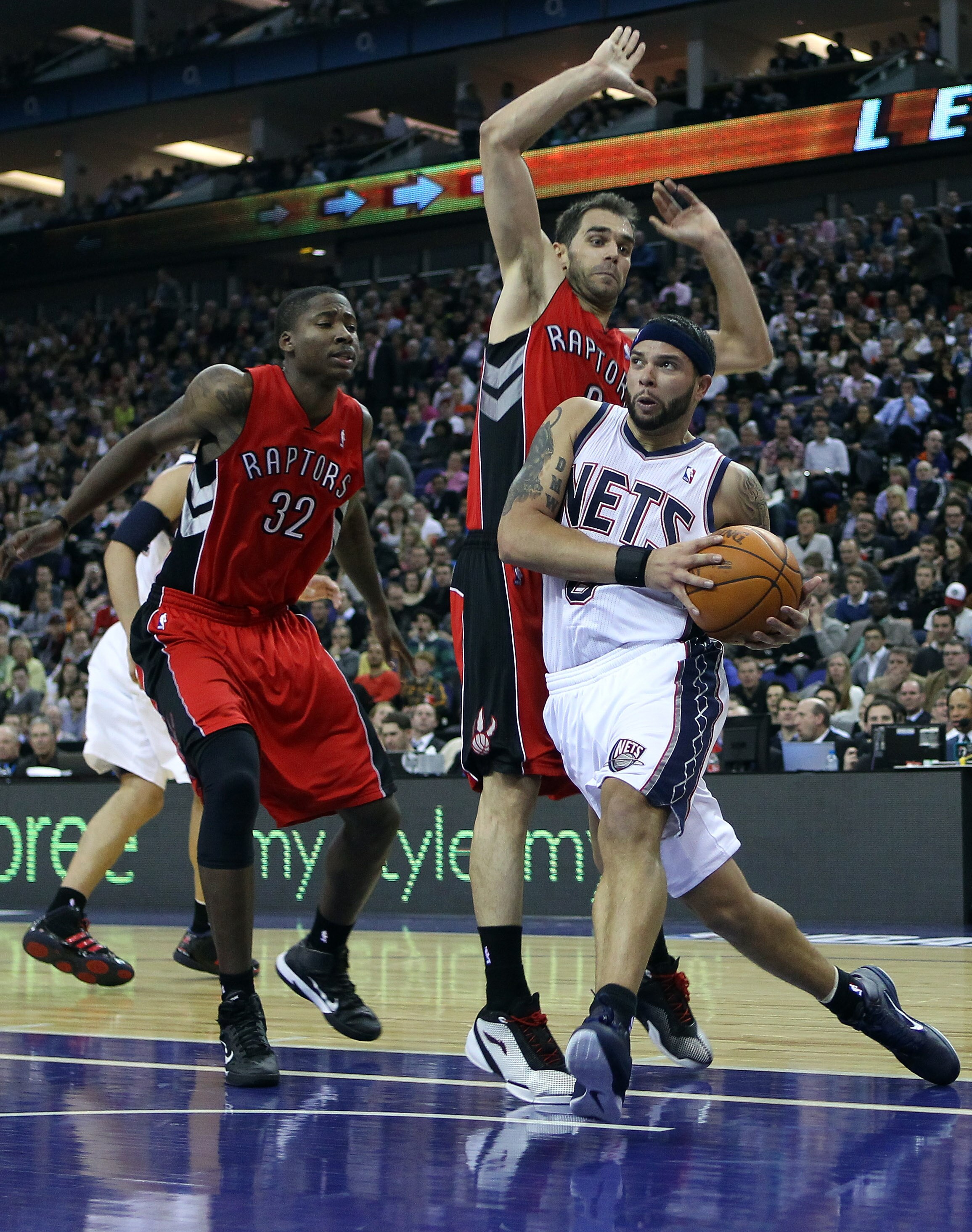 LONDON, ENGLAND - MARCH 04:  Deron Williams of the Nets runs past the Raptors defence during the NBA match between New Jersey Nets and the Toronto Raptors at the O2 Arena on March 4, 2011 in London, England. NOTE TO USER: User expressly acknowledges and a