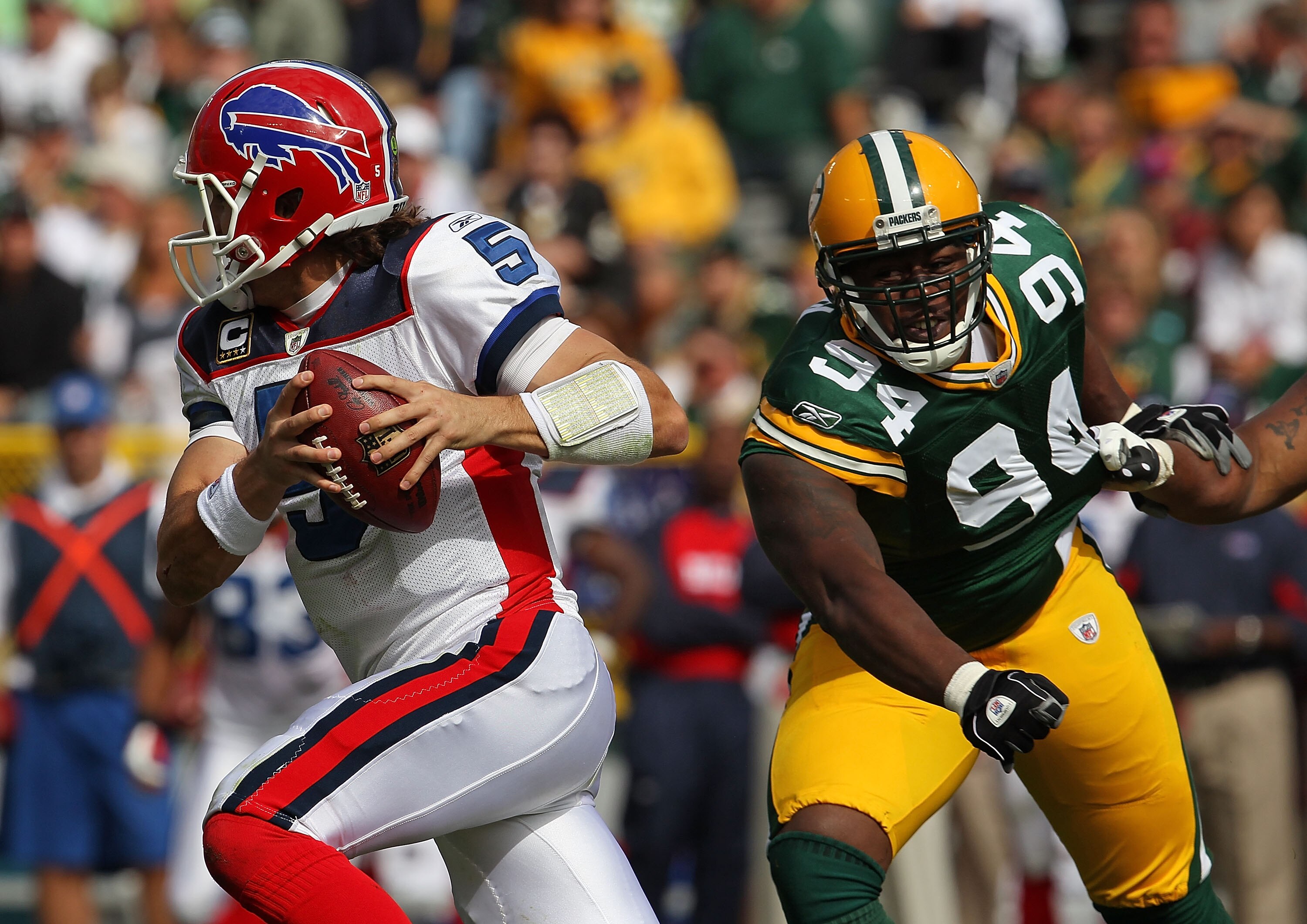 GREEN BAY, WI - SEPTEMBER 19: Trent Edwards #5 of the Buffalo Bills runs past Jarius Wynn #94 of the Green Bay Packers at Lambeau Field on September 19, 2010 in Green Bay, Wisconsin. The Packers defeated the Bills 34-7. (Photo by Jonathan Daniel/Getty Ima