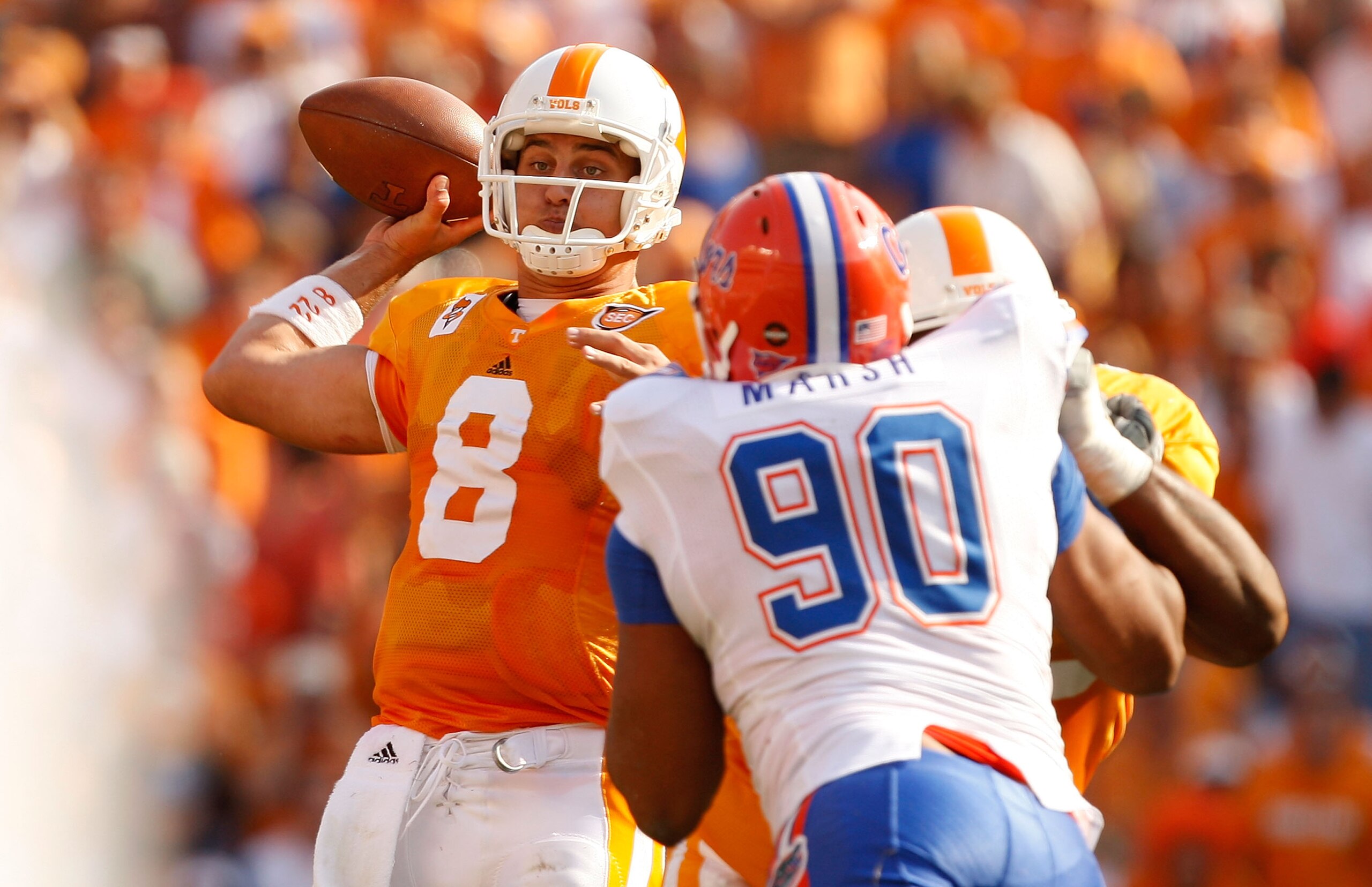 KNOXVILLE, TN - SEPTEMBER 20:  Lawrence Marsh #90 of the Florida Gators tries to stop Jonathan Crompton #8 of the Tennessee Volunteers during their game at Neyland Stadium on September 20, 2008 in Knoxville, Tennessee.  (Photo by Streeter Lecka/Getty Imag