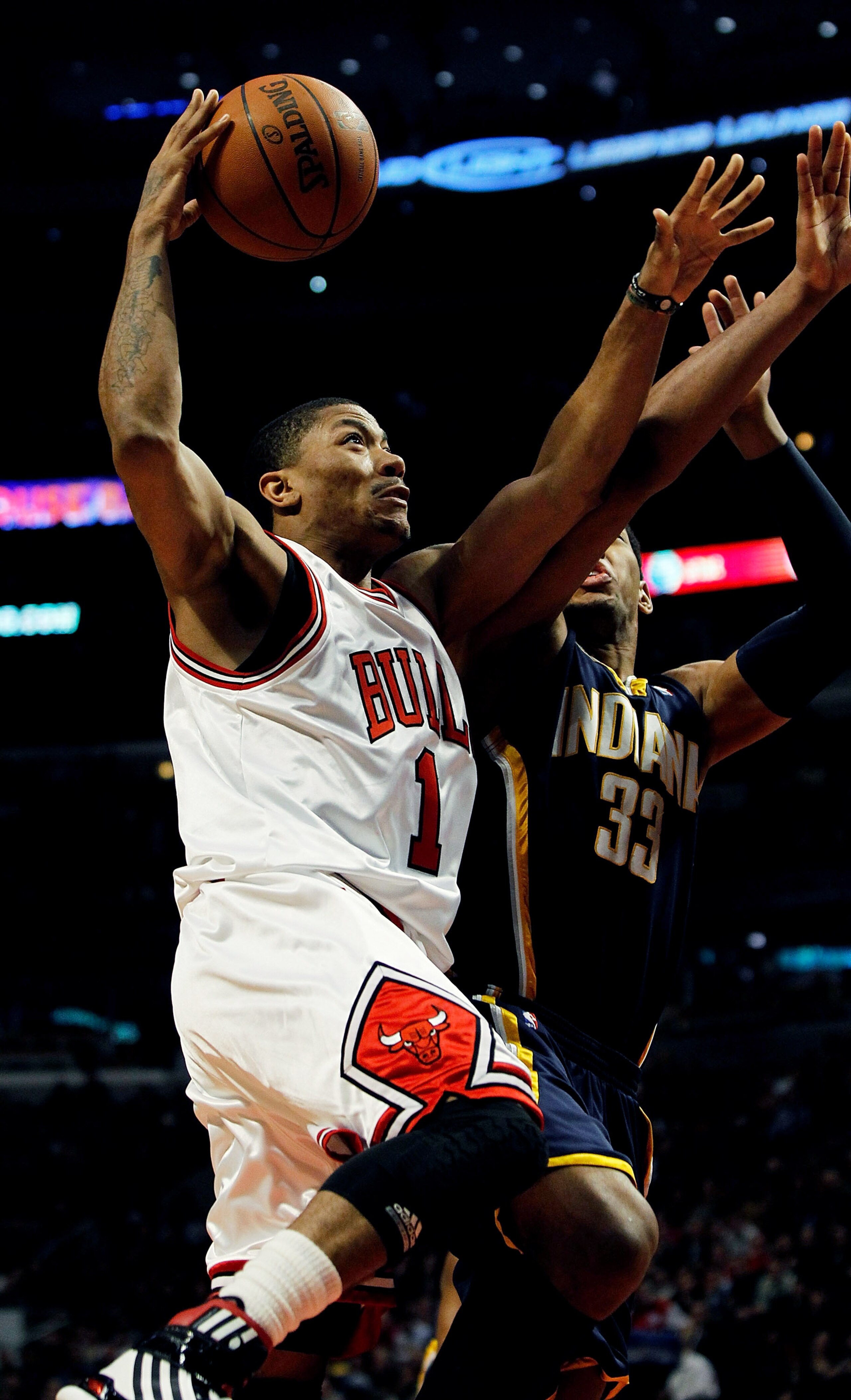 CHICAGO - FEBRUARY 24: Derrick Rose #1 of the Chicago Bulls drives to the basket against Danny Granger #33 of the Indiana Pacers at the United Center on February 24, 2010 in Chicago, Illinois. The Bulls defeated the Pacers 120-110. NOTE TO USER: User expr