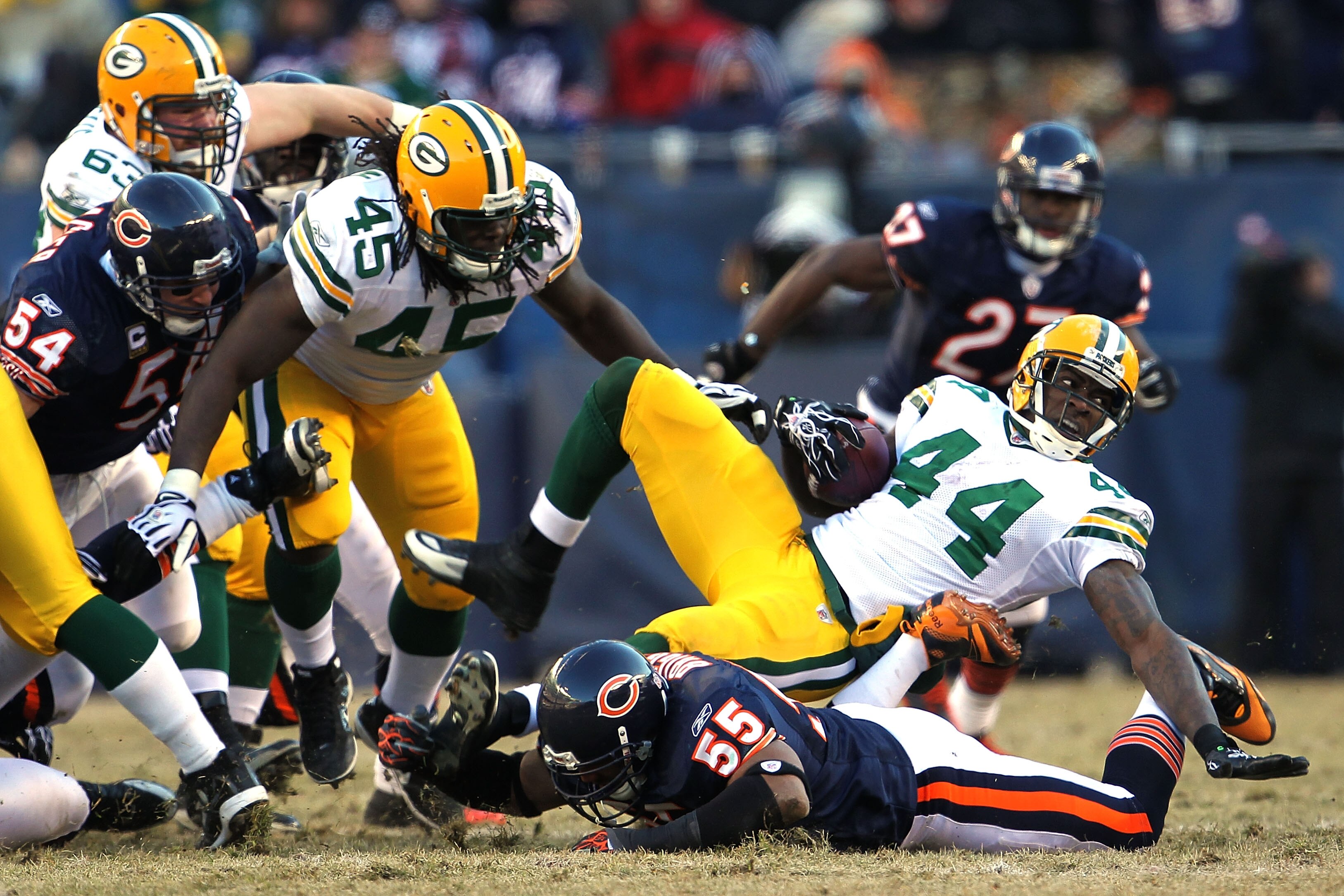 CHICAGO, IL - JANUARY 23:  James Starks #44 of the Green Bay Packers is tackled by Lance Briggs #55 of the Chicago Bears in the NFC Championship Game at Soldier Field on January 23, 2011 in Chicago, Illinois.  (Photo by Jamie Squire/Getty Images)