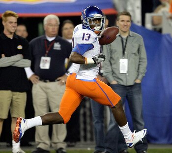 GLENDALE, AZ - JANUARY 04:  Brandyn Thompson #13 of the Boise State Broncos runs into the endzone after a 50-yard interception return for a touchdown in the first quarter against the TCU Horned Frogs during the Tostitos Fiesta Bowl at the Universtity of P