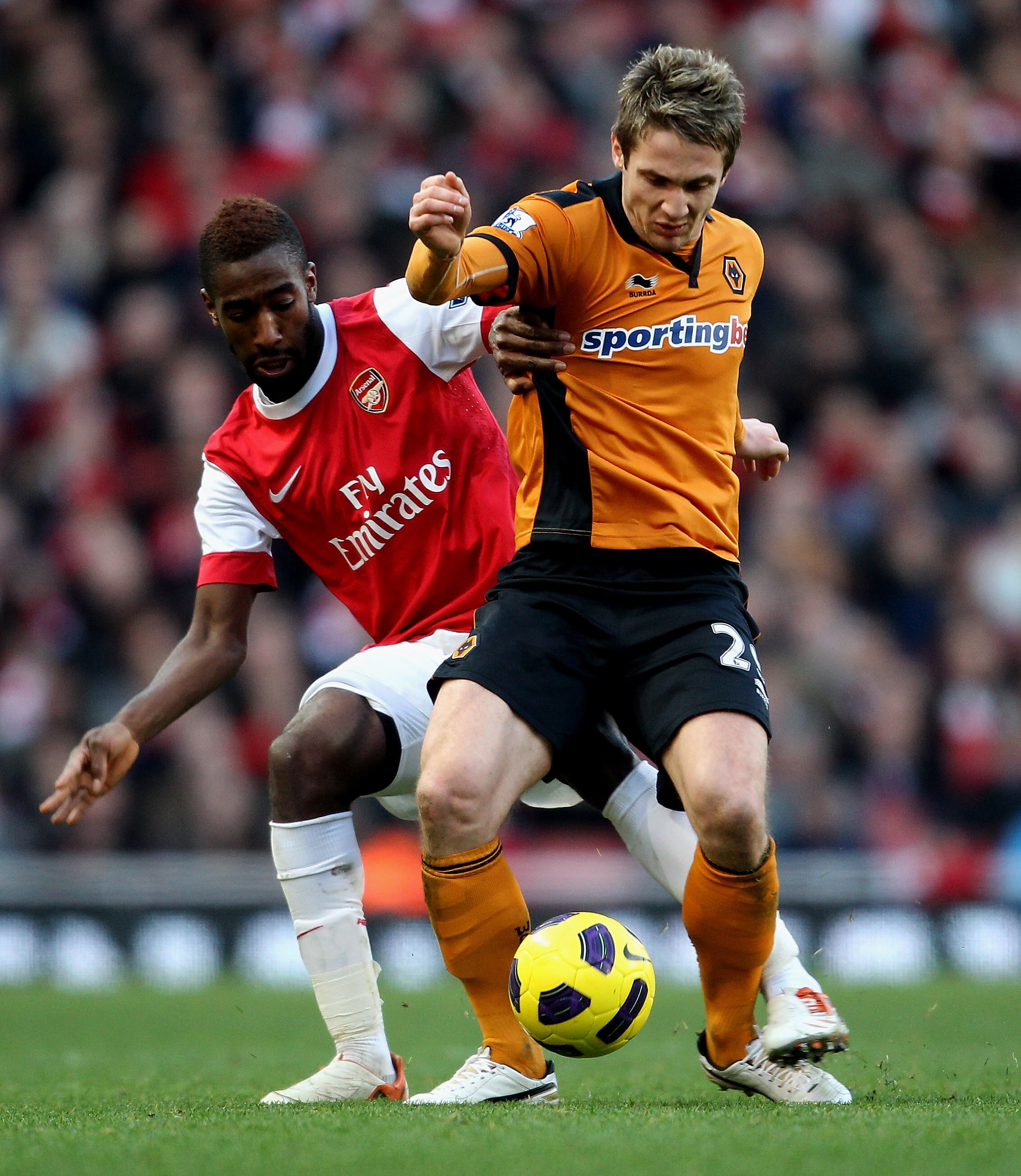 LONDON, ENGLAND - FEBRUARY 12:  Kevin Doyle of Wolves (R) in action with Johan Djourou of Arsenal during the Barclays Premier League match between Arsenal and Wolverhampton Wanderers on February 12, 2011 in London, England.  (Photo by Scott Heavey/Getty I