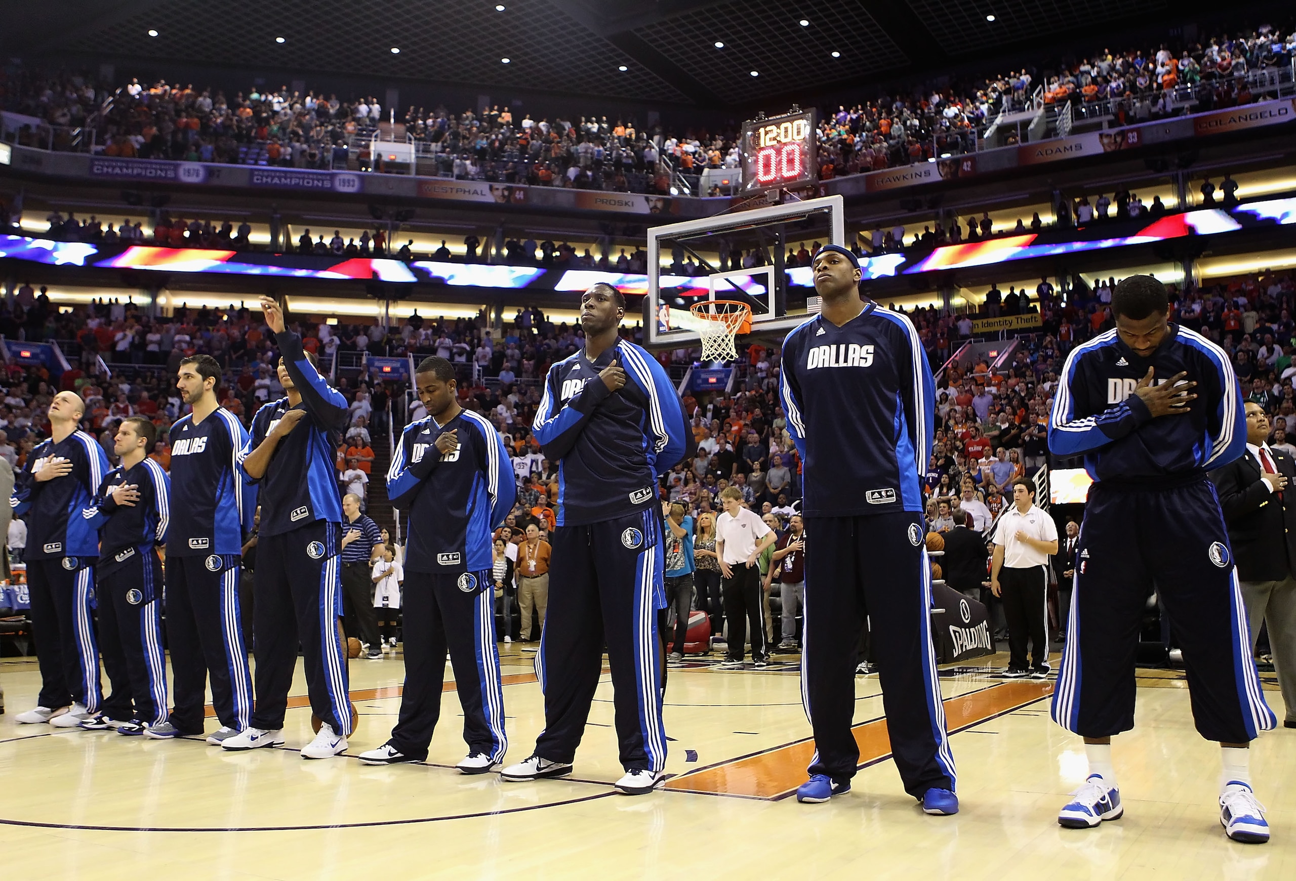 PHOENIX, AZ - MARCH 27: The Dallas Mavericks before the NBA game against the Phoenix Suns at US Airways Center on March 27, 2011 in Phoenix, Arizona. The Mavericks defeated the Suns 91-83. NOTE TO USER: User expressly acknowledges and agrees that, by do PHOENIX, AZ - MARCH 27: The Dallas Mavericks before the NBA game against the Phoenix Suns at US Airways Center on March 27, 2011 in Phoenix, Arizona. The Mavericks defeated the Suns 91-83. NOTE TO USER: User expressly acknowledges and agrees that, by do
