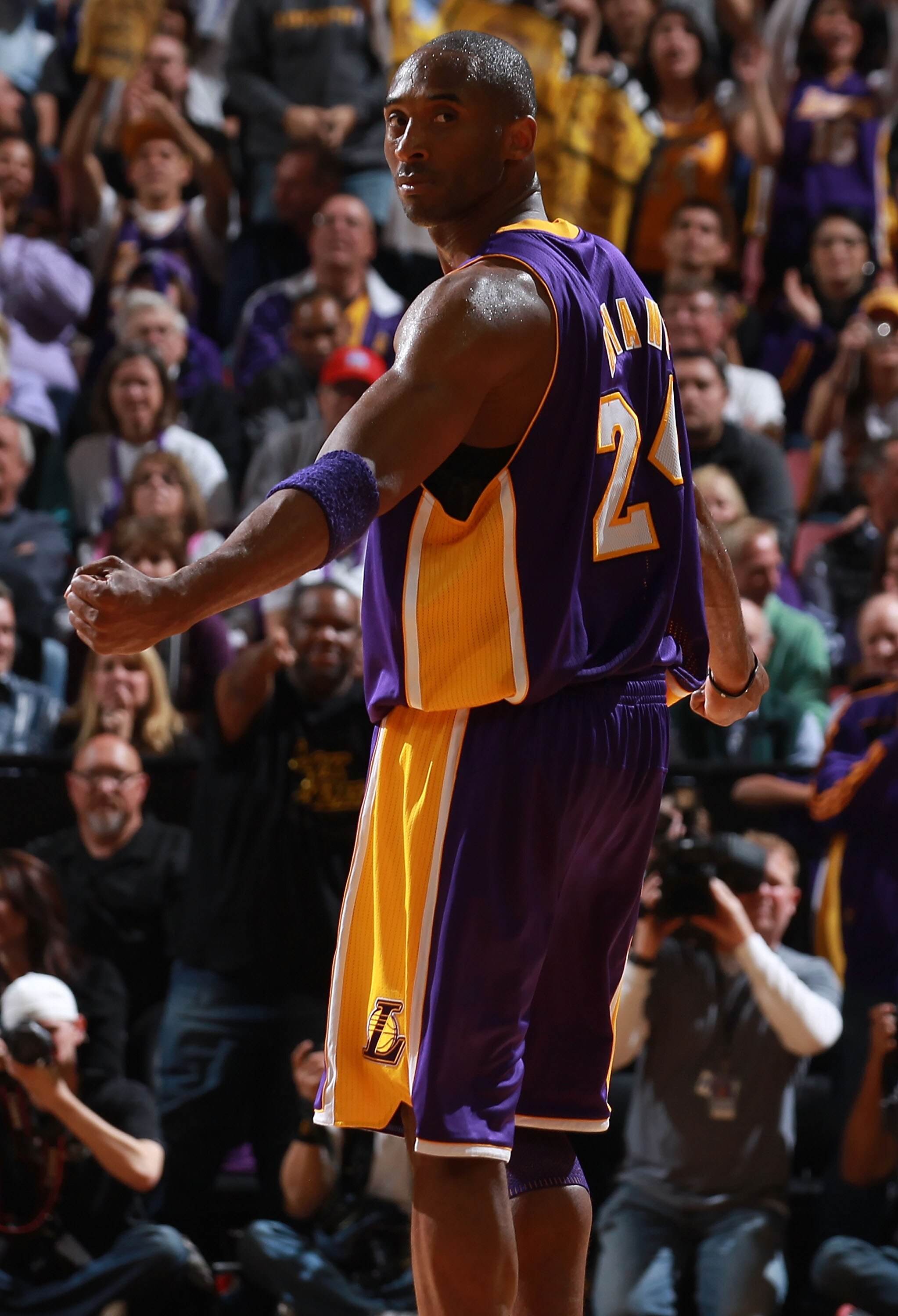 SACRAMENTO, CA - APRIL 13:  Kobe Bryant #24 of the Los Angeles Lakers celebrates against the Sacramento Kings look on against  on April 13, 2011 at Power Balence Pavilion in Sacramento, California. NOTE TO USER: User expressly acknowledges and agrees that