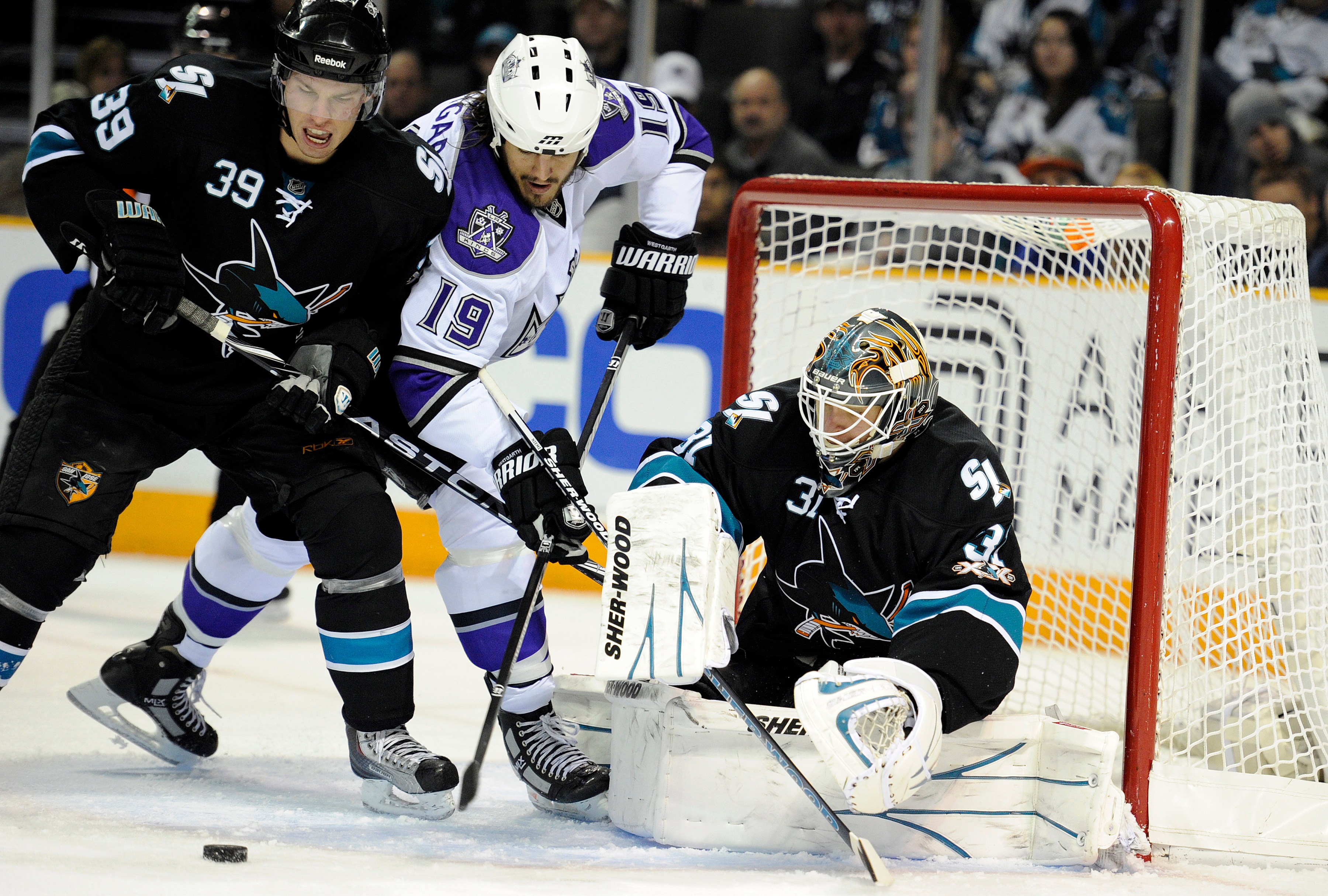 SAN JOSE, CA - DECEMBER 27:  Goalie Antti Niemi #31of the San Jose Sharks makes a save on the rebound shot of Kevin Westgarth #19 of the Los Angeles Kings during an NHL hockey game at the HP Pavilion on December 27, 2010 in San Jose, California. (Photo by