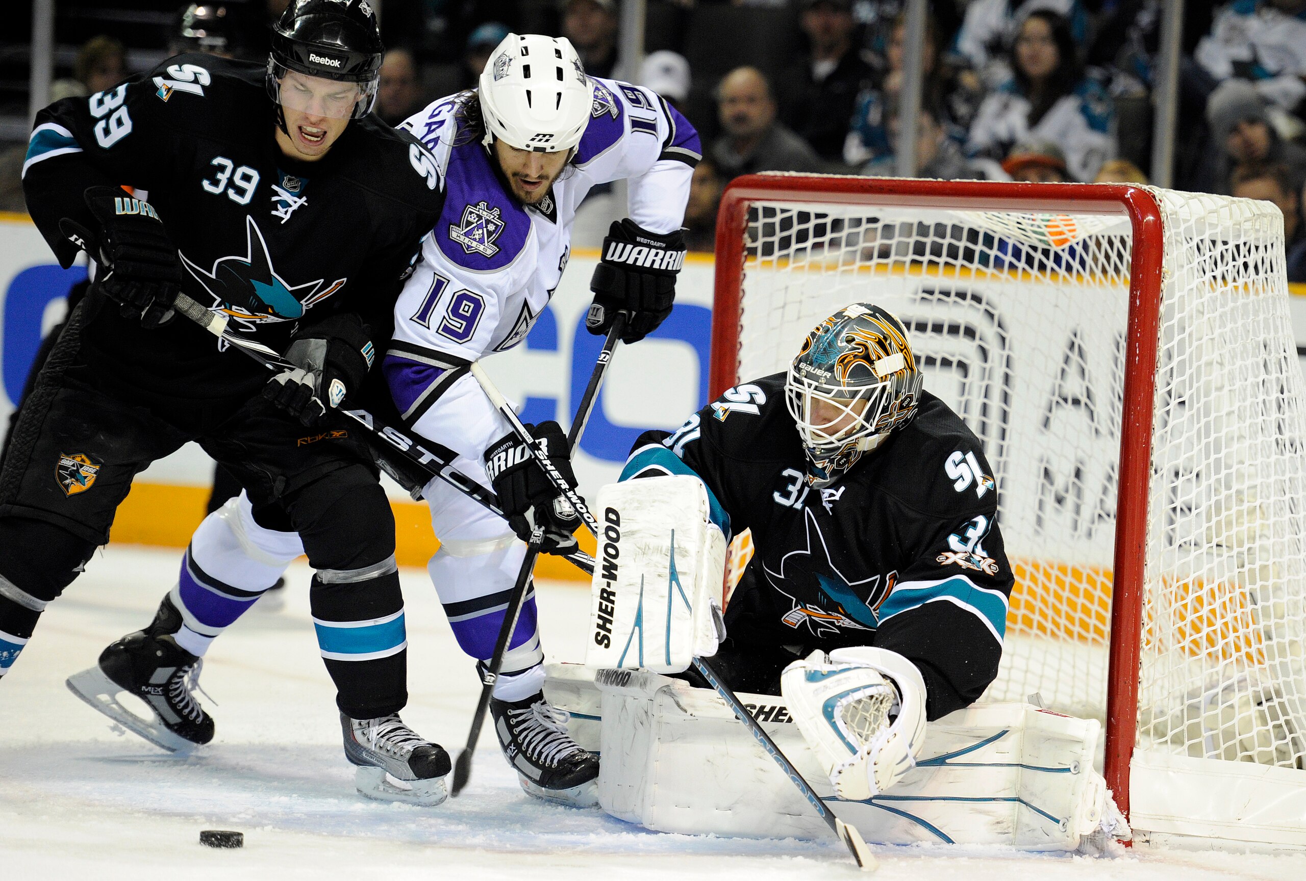 SAN JOSE, CA - DECEMBER 27:  Goalie Antti Niemi #31of the San Jose Sharks makes a save on the rebound shot of Kevin Westgarth #19 of the Los Angeles Kings during an NHL hockey game at the HP Pavilion on December 27, 2010 in San Jose, California. (Photo by
