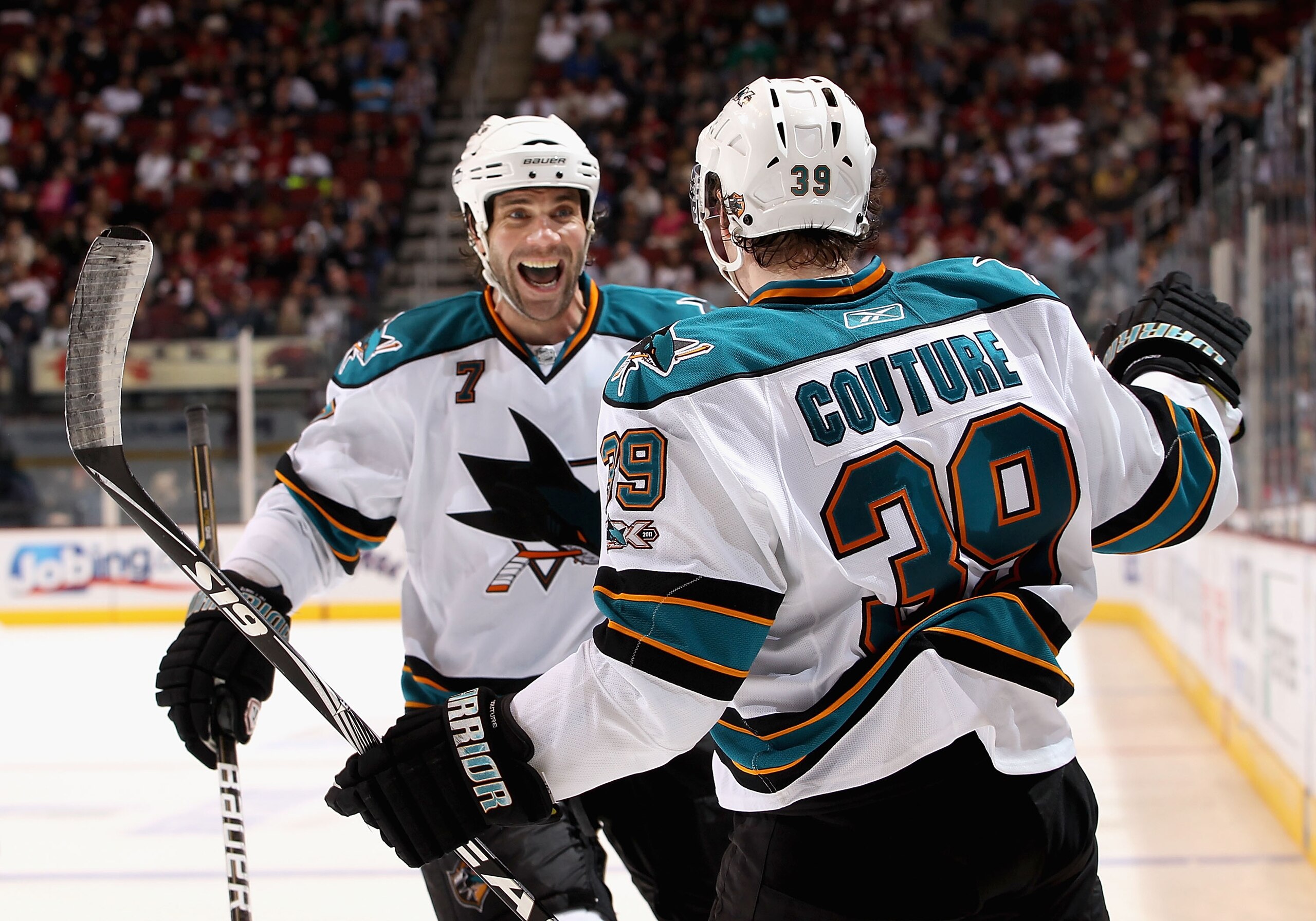 GLENDALE, AZ - MARCH 26:  Niclas Wallin #7 and Logan Couture #39 of the San Jose Sharks celebrate after Couture scored a third period goal against the Phoenix Coyotes during the NHL game at Jobing.com Arena on March 26, 2011 in Glendale, Arizona. The Shar