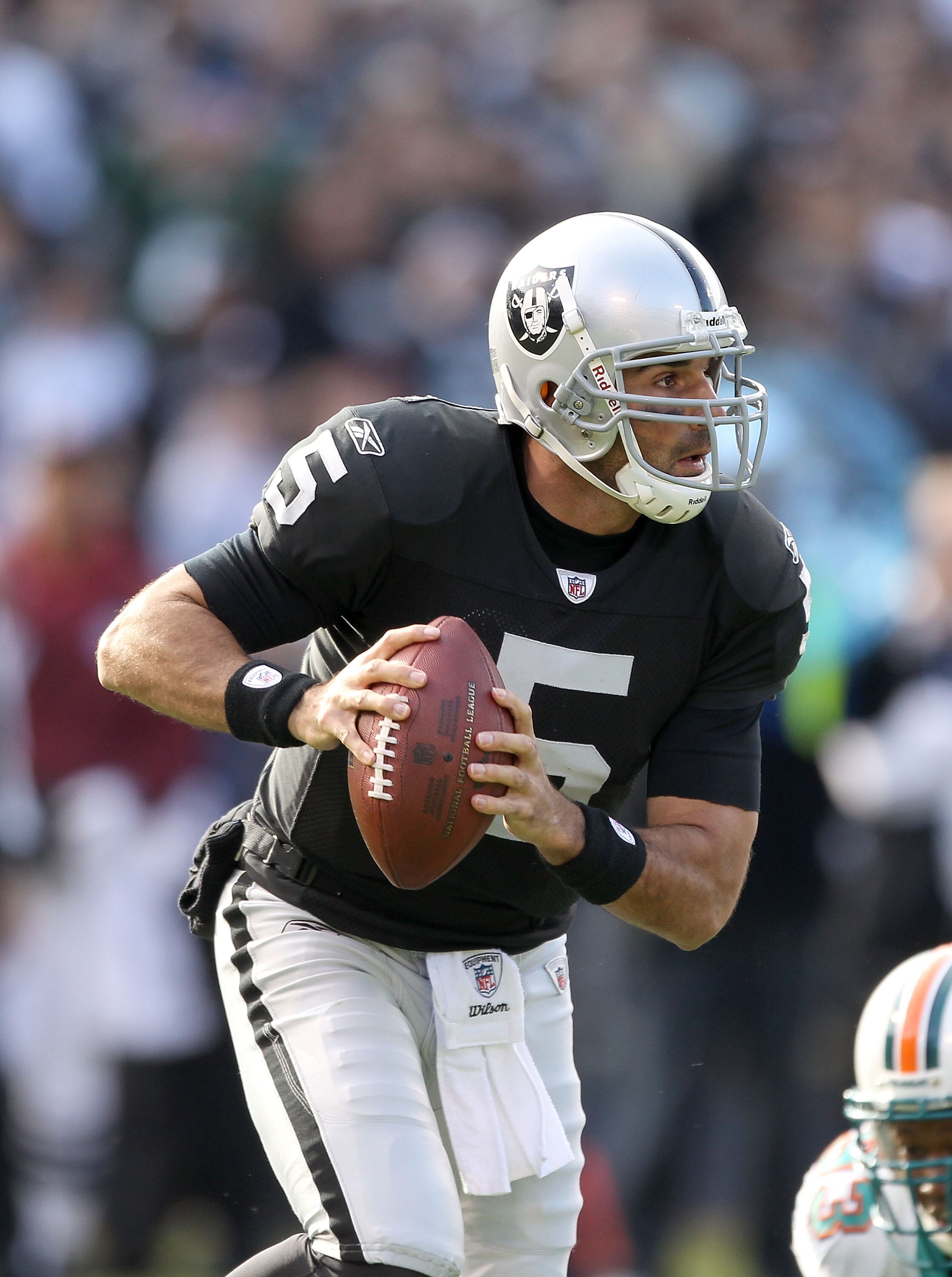 OAKLAND, CA - NOVEMBER 28: Bruce Gradkowski #5 of the Oakland Raiders in action against the Miami Dolphins at Oakland-Alameda County Coliseum on November 28, 2010 in Oakland, California. (Photo by Ezra Shaw/Getty Images) OAKLAND, CA - NOVEMBER 28: Bruce Gradkowski #5 of the Oakland Raiders in action against the Miami Dolphins at Oakland-Alameda County Coliseum on November 28, 2010 in Oakland, California. (Photo by Ezra Shaw/Getty Images)