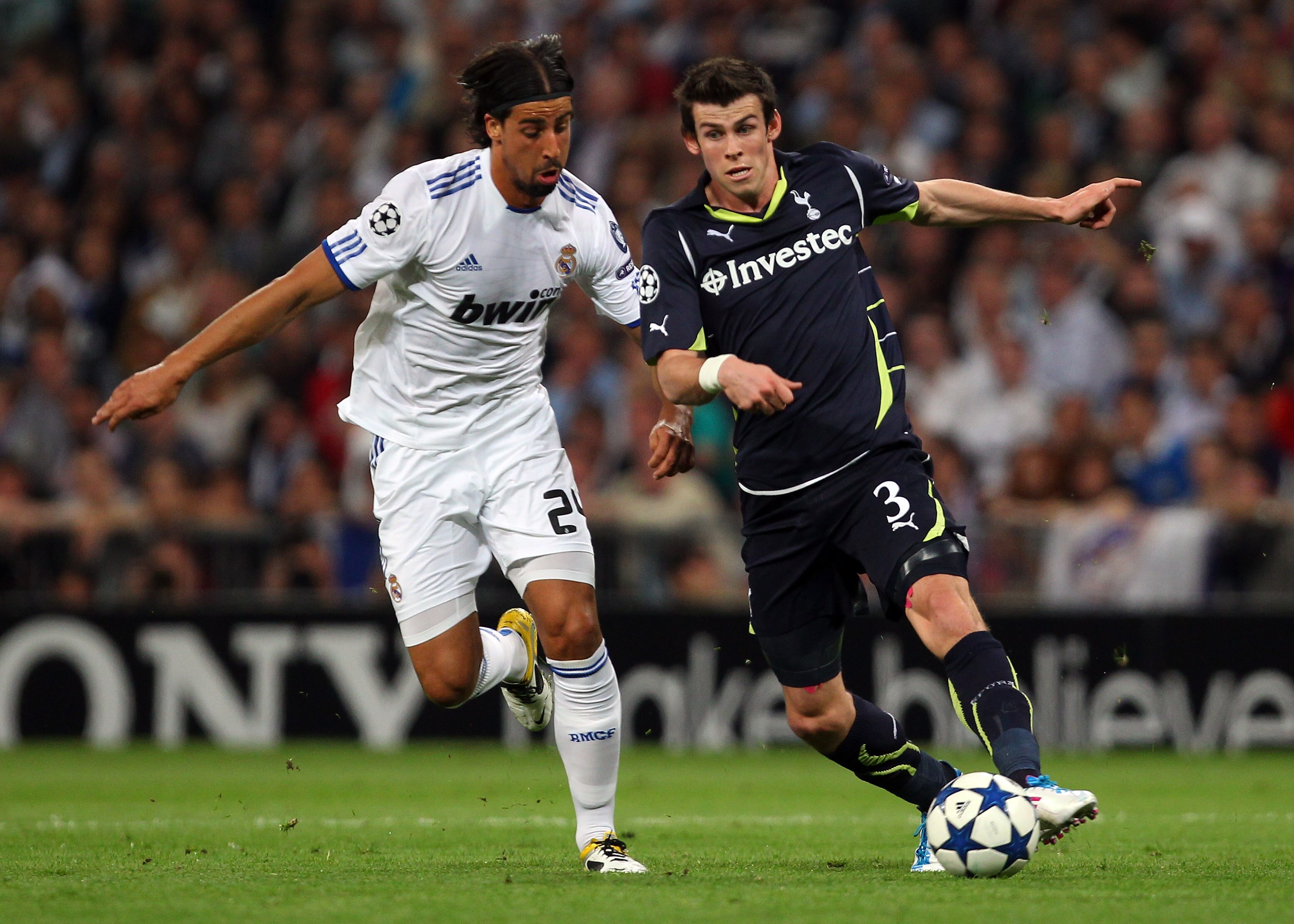 MADRID, SPAIN - APRIL 05: Gareth Bale of Tottenham Hotspur is challenged by Sami Khedira of Real Madrid during the UEFA Champions League Quarter Final first leg match between Real Madrid and Tottenham Hotspur at Estadio Santiago Bernabeu on April 5, 2011