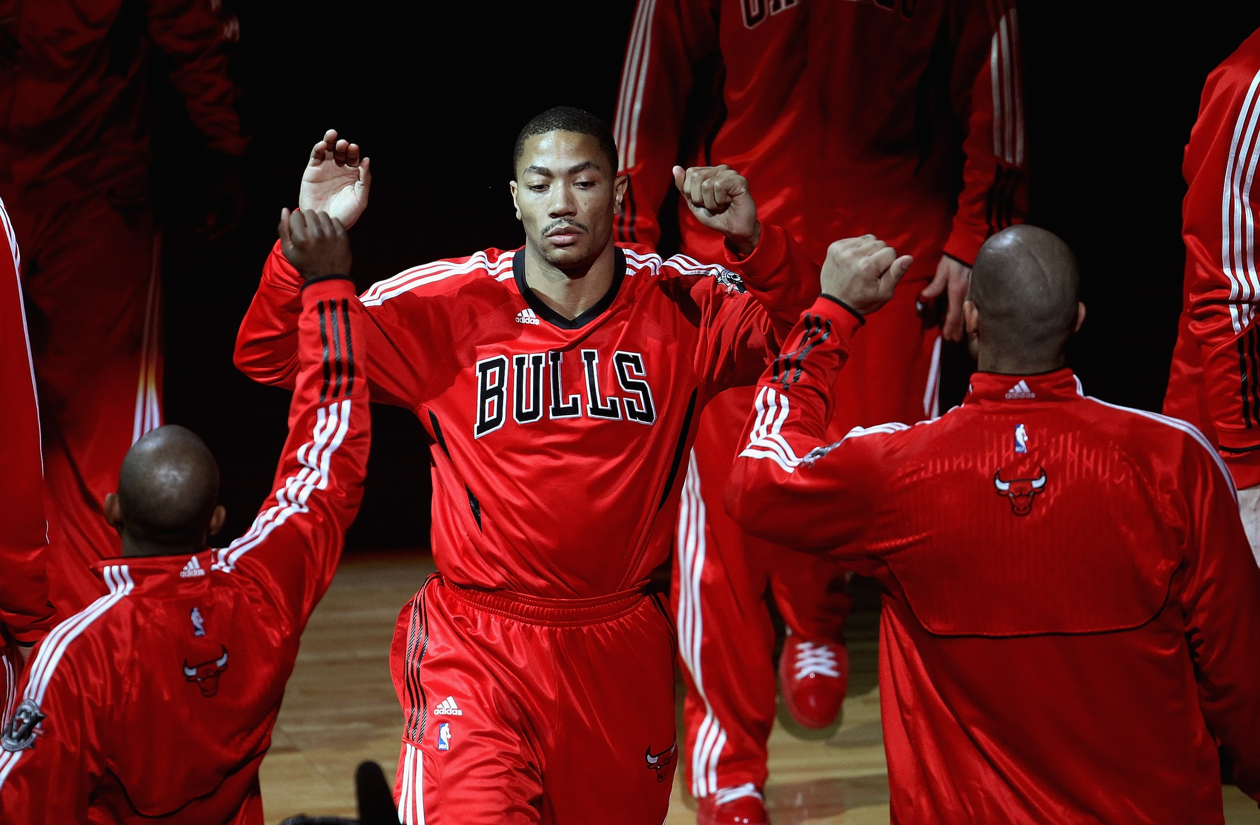 CHICAGO, IL - APRIL 13: Derrick Rose #1 of the Chicago Bulls is greeted by teammates during player introductions before a game against the New Jersey Nets at United Center on April 13, 2011 in Chicago, Illinois. The Bulls defeated the Nets 97-92. NOTE TO CHICAGO, IL - APRIL 13: Derrick Rose #1 of the Chicago Bulls is greeted by teammates during player introductions before a game against the New Jersey Nets at United Center on April 13, 2011 in Chicago, Illinois. The Bulls defeated the Nets 97-92. NOTE TO