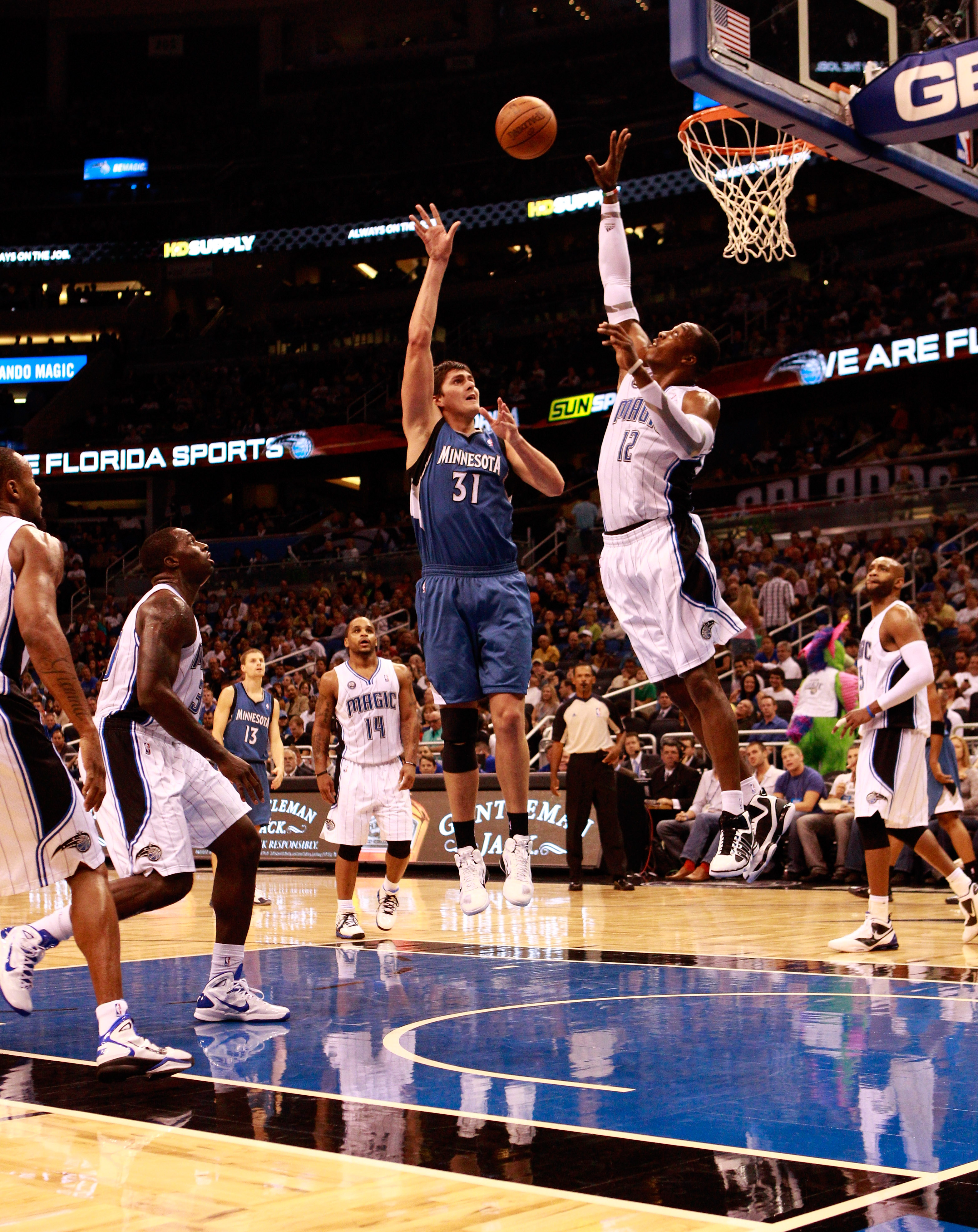 ORLANDO, FL - NOVEMBER 03:  Dwight Howard #12 of the Orlando Magic attempts to block the shot of Darko Milicic #31 of the Minnesota Timberwolves during the game at Amway Arena on November 3, 2010 in Orlando, Florida.  NOTE TO USER: User expressly acknowle