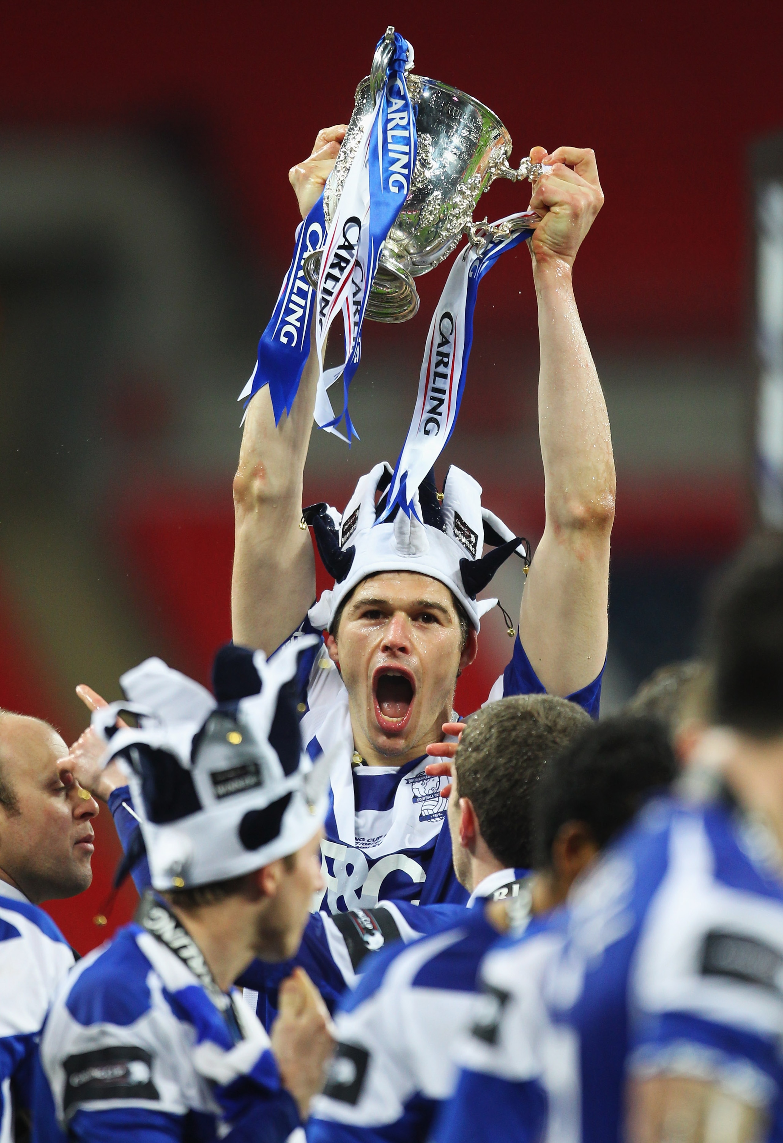 LONDON, ENGLAND - FEBRUARY 27:  Nikola Zigic of Birmingham City celebrates with the trophy after the Carling Cup Final between Arsenal and Birmingham City at Wembley Stadium on February 27, 2011 in London, England.  (Photo by Alex Livesey/Getty Images)