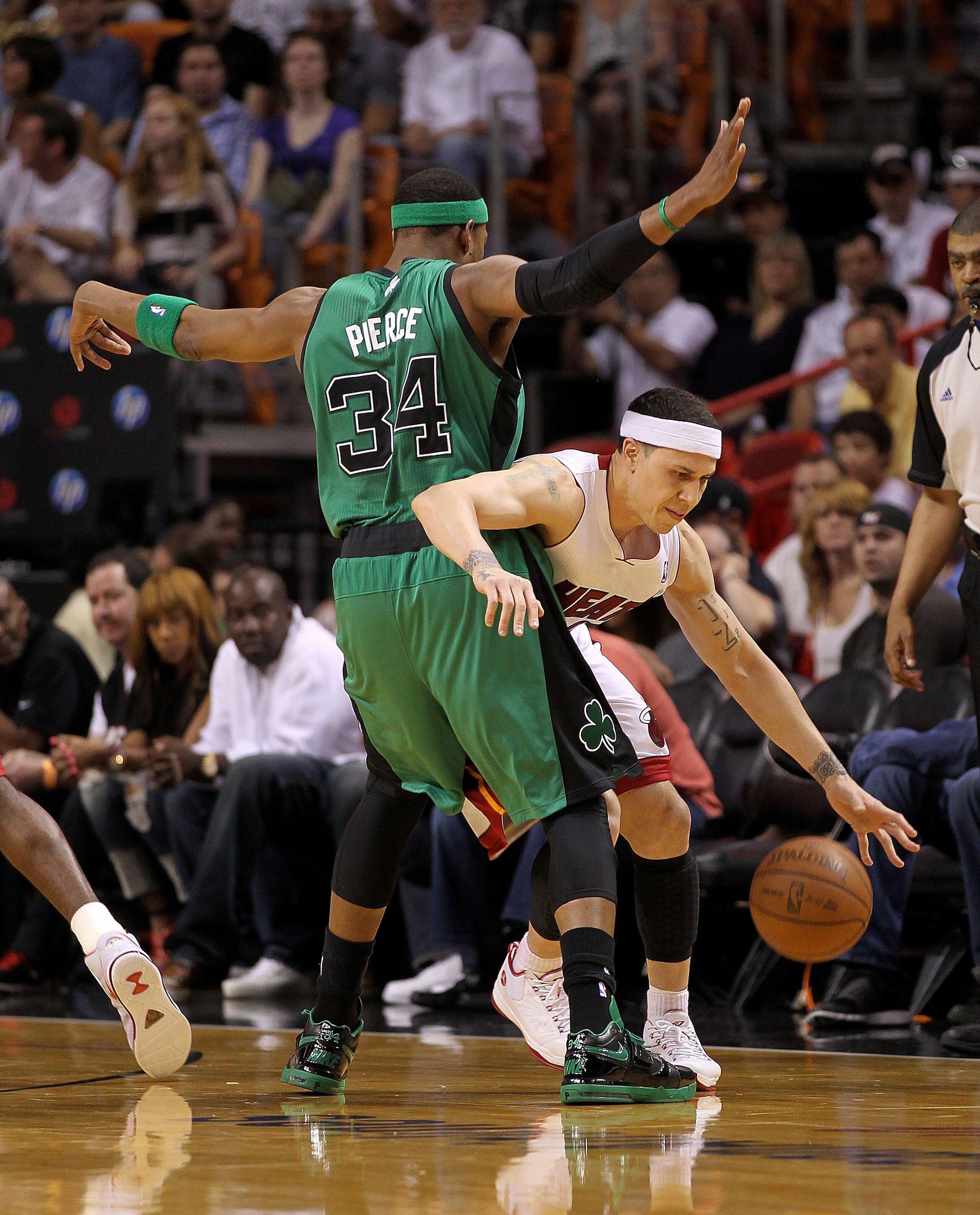 MIAMI, FL - APRIL 10: Mike Bibby #0 of the Miami Heat dribbles around Paul Pierce #34 of the Boston Celtics during a game at American Airlines Arena on April 10, 2011 in Miami, Florida. NOTE TO USER: User expressly acknowledges and agrees that, by downl MIAMI, FL - APRIL 10: Mike Bibby #0 of the Miami Heat dribbles around Paul Pierce #34 of the Boston Celtics during a game at American Airlines Arena on April 10, 2011 in Miami, Florida. NOTE TO USER: User expressly acknowledges and agrees that, by downl
