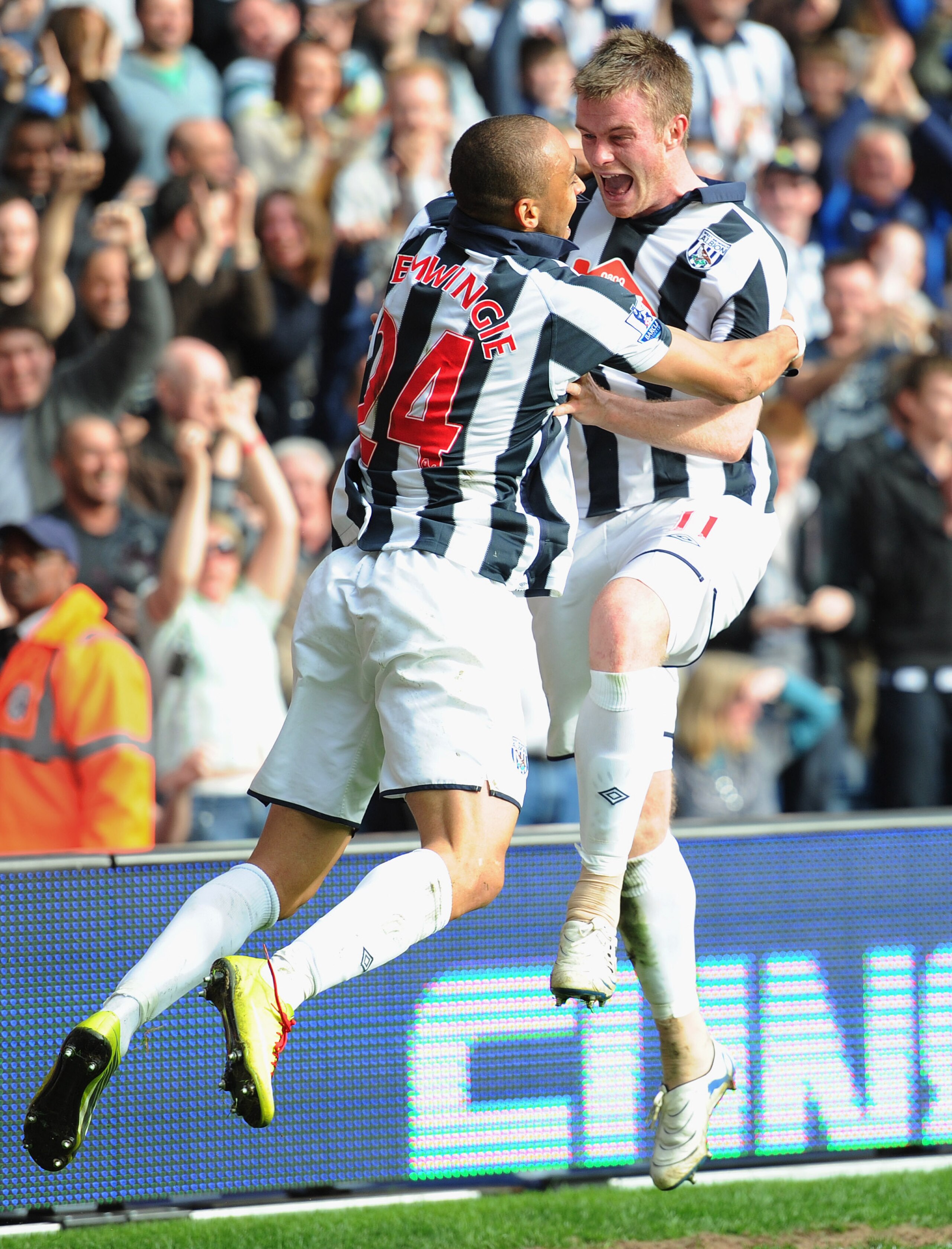 WEST BROMWICH, ENGLAND - APRIL 02:  Chris Brunt of West Brom celebrates scoring to make it 2-1 from the spot with team mate Peter Odemwingie during the Barclays Premier League match between West Bromwich Albion and Liverpool at The Hawthorns on April 2, 2