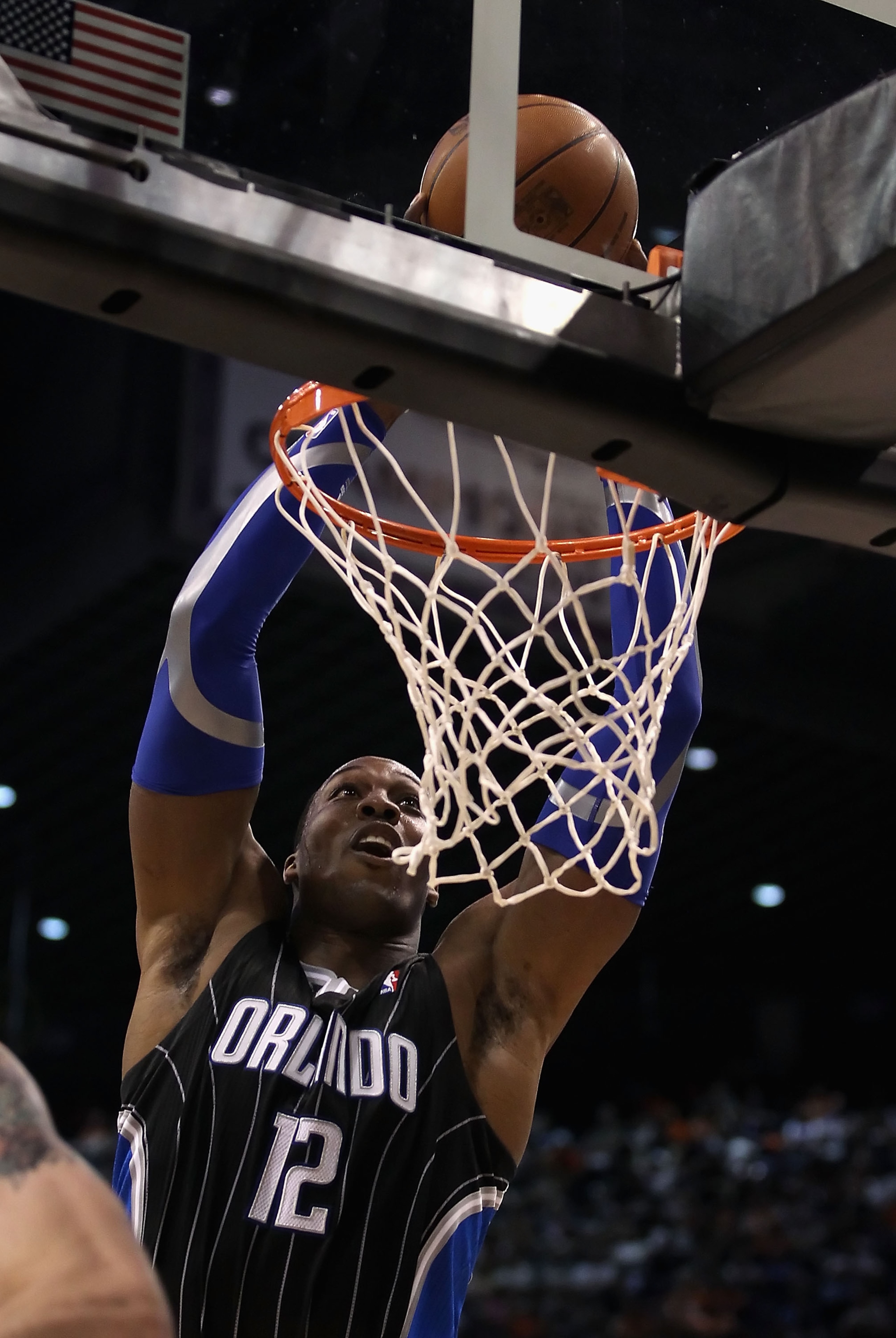 PHOENIX, AZ - MARCH 13: Dwight Howard #12 of the Orlando Magic slam dunks the ball during the NBA game against the Phoenix Suns at US Airways Center on March 13, 2011 in Phoenix, Arizona. The Magic defeated the Suns 111-88. NOTE TO USER: User expressly a PHOENIX, AZ - MARCH 13: Dwight Howard #12 of the Orlando Magic slam dunks the ball during the NBA game against the Phoenix Suns at US Airways Center on March 13, 2011 in Phoenix, Arizona. The Magic defeated the Suns 111-88. NOTE TO USER: User expressly a