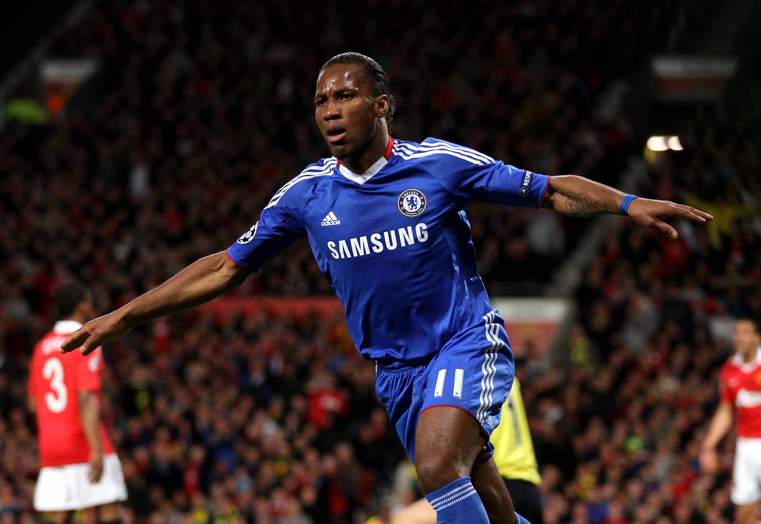 MANCHESTER, ENGLAND - APRIL 12: Didier Drogba of Chelsea celebrates scoring his team's first goal during the UEFA Champions League Quarter Final second leg match between Manchester United and Chelsea at Old Trafford on April 12, 2011 in Manchester, Engla MANCHESTER, ENGLAND - APRIL 12: Didier Drogba of Chelsea celebrates scoring his team's first goal during the UEFA Champions League Quarter Final second leg match between Manchester United and Chelsea at Old Trafford on April 12, 2011 in Manchester, Engla
